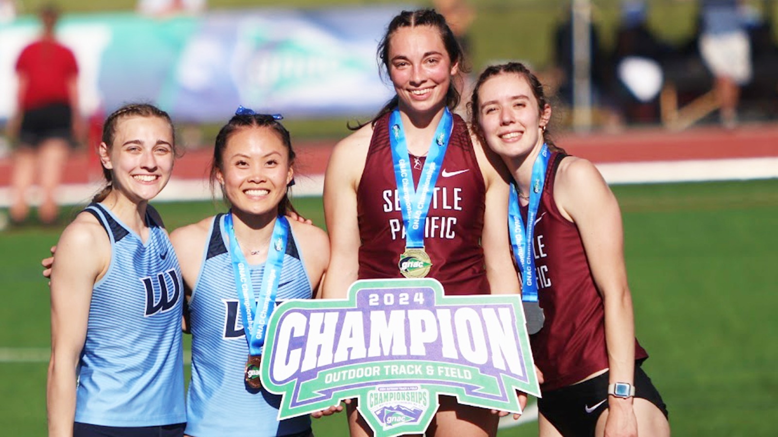 Lizzy Daugherty (1st) and Emily Thomason (2nd) on the GNAC pole vault awards podium.