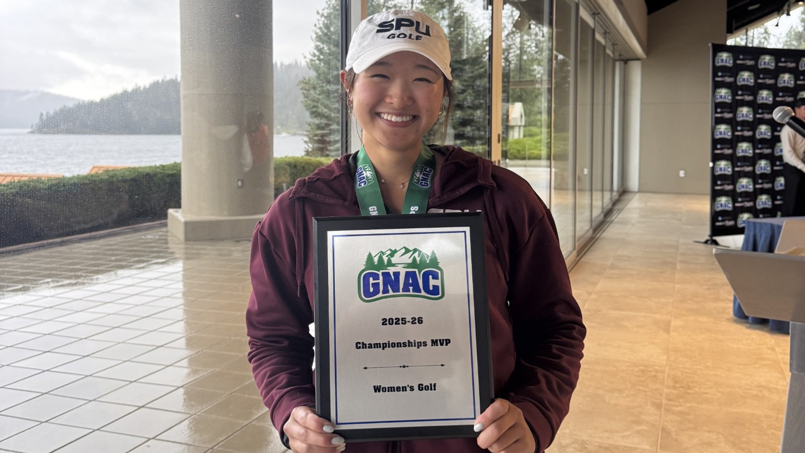 Lauren Lee with her GNAC championship plaque.