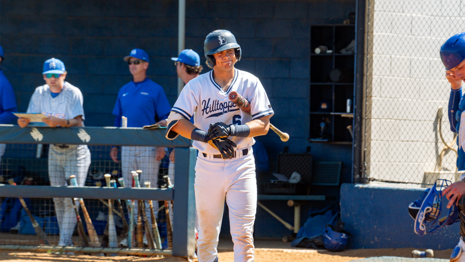 Trevor Sebek adjusts batting gloves