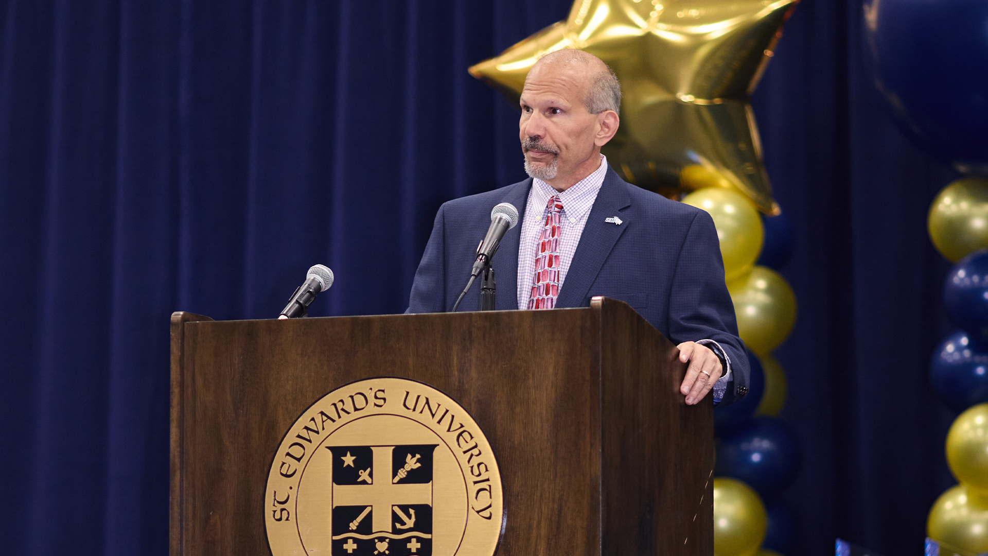 Jim Sarra at the Podium