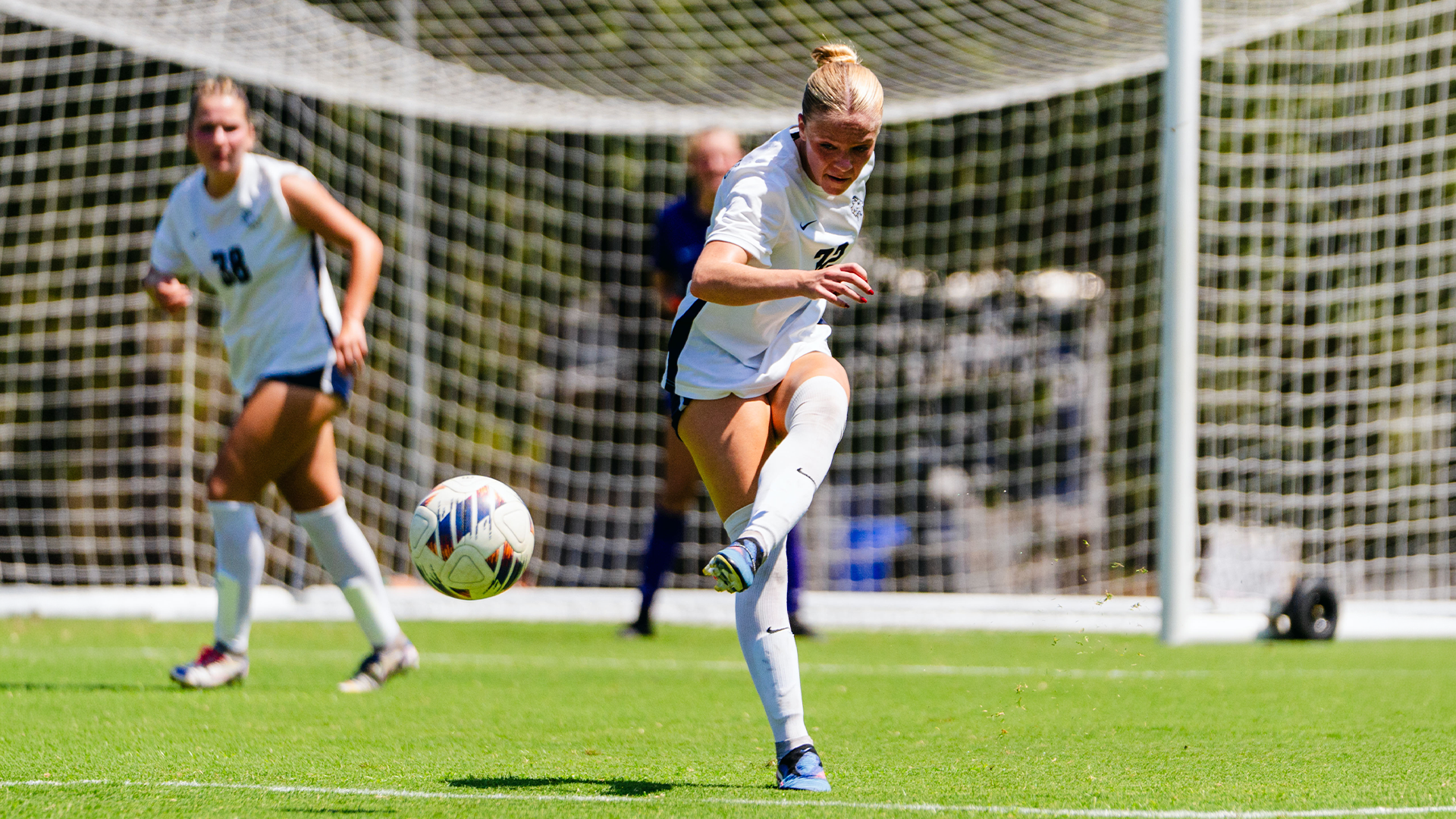 Tess Dabney clearing the ball