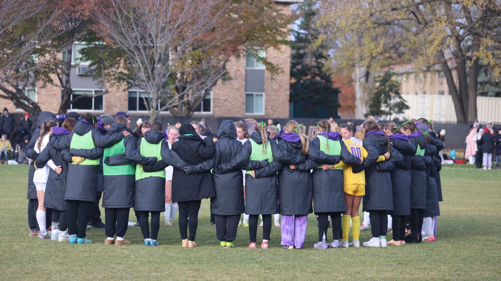 st. kate's soccer huddle at home