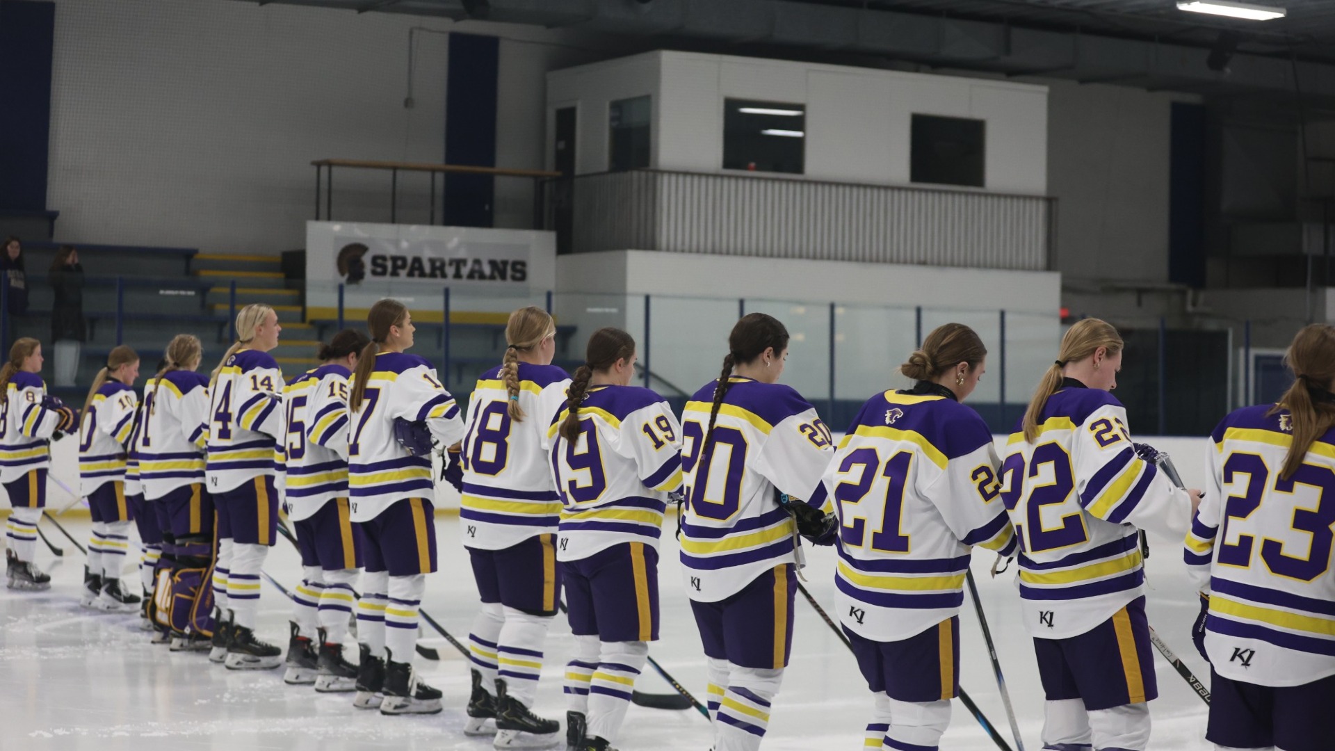 Hockey team lined up on blue line