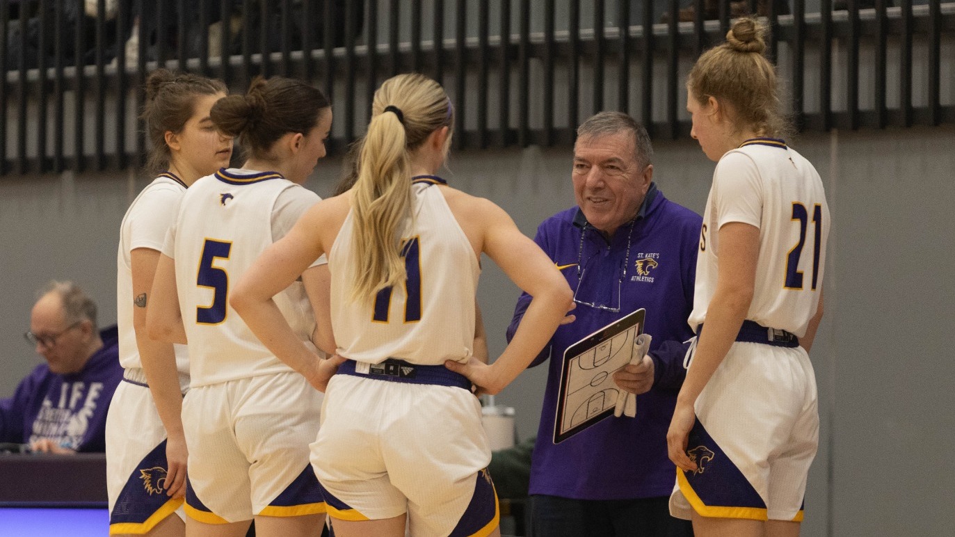 Don Mulhern with basketball players