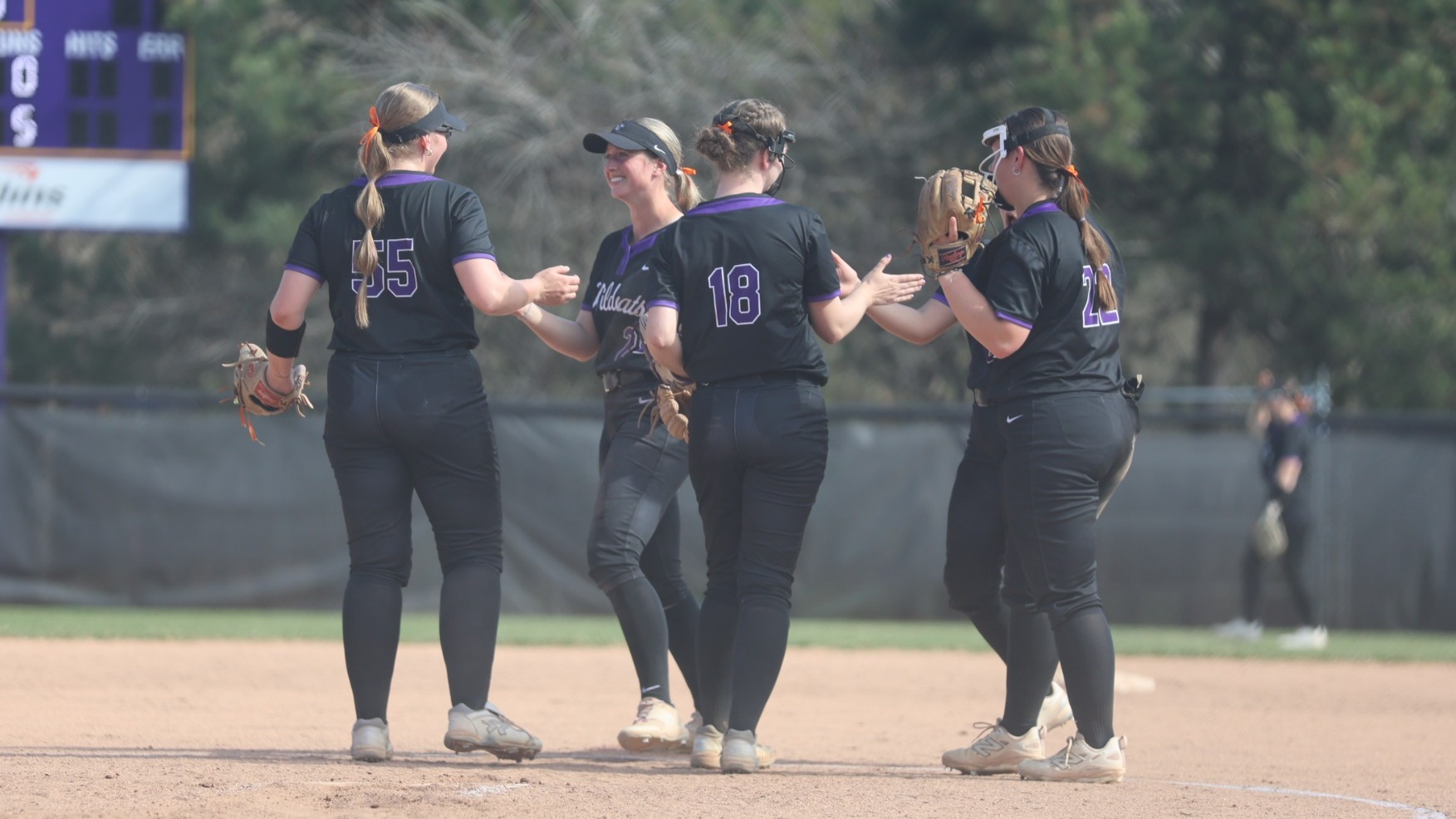 Softball team huddle in the circle