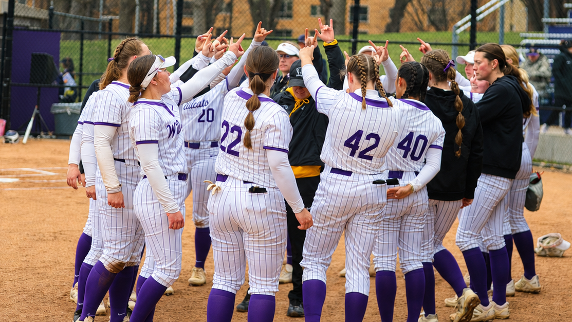 Coach Powers with team huddling
