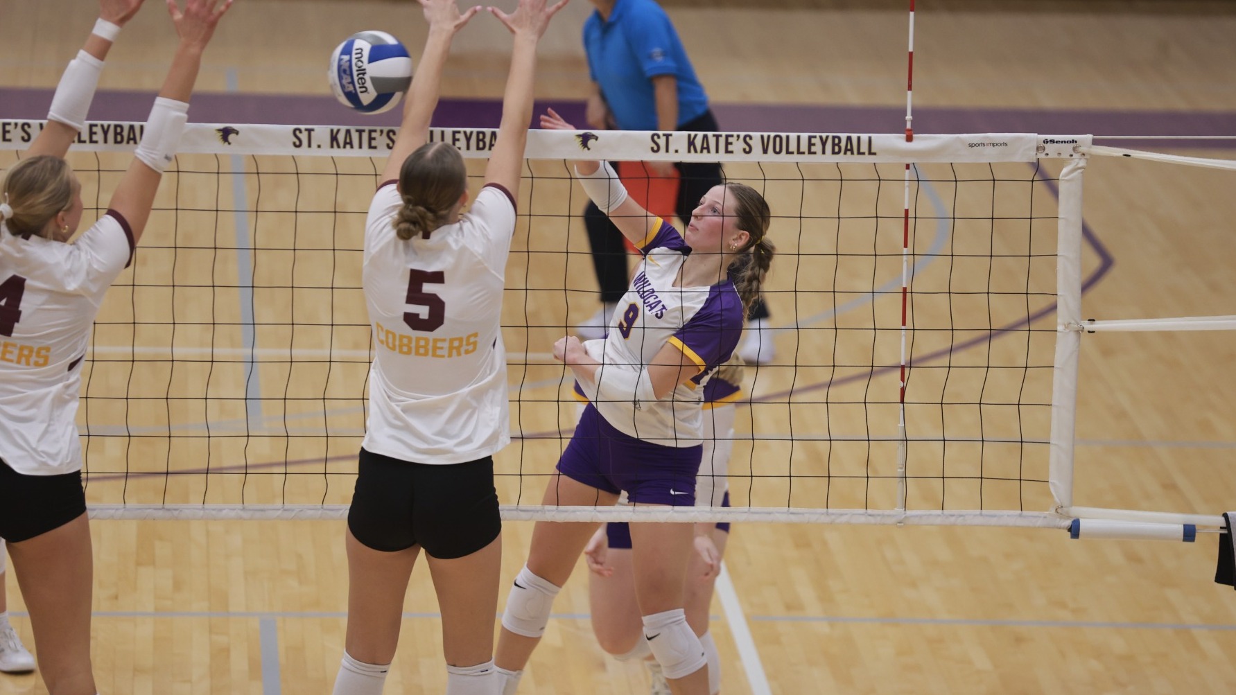 Maddie Newton at the net against Concordia