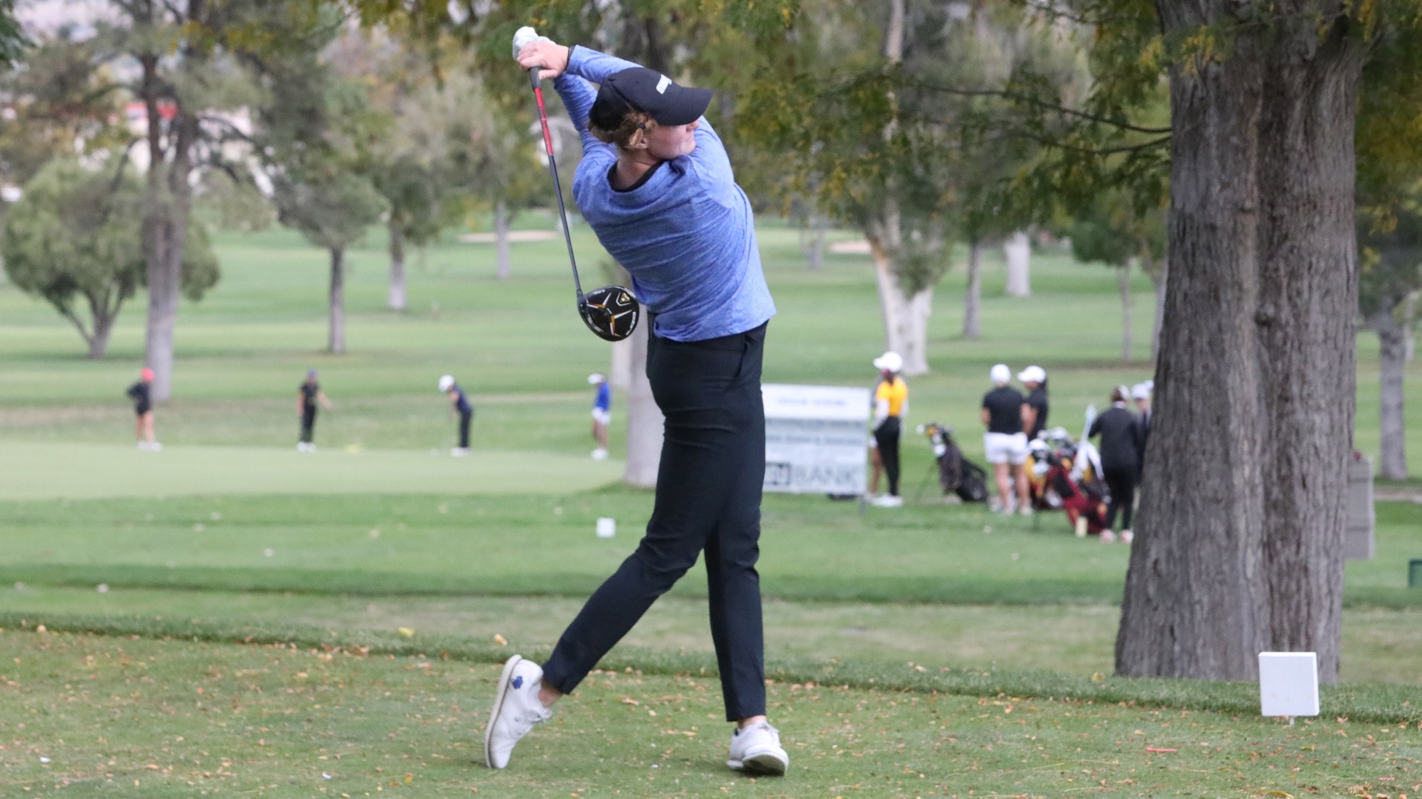 Taylor Wilczek holds her follow through after a tee shot at the Pueblo Country Club.