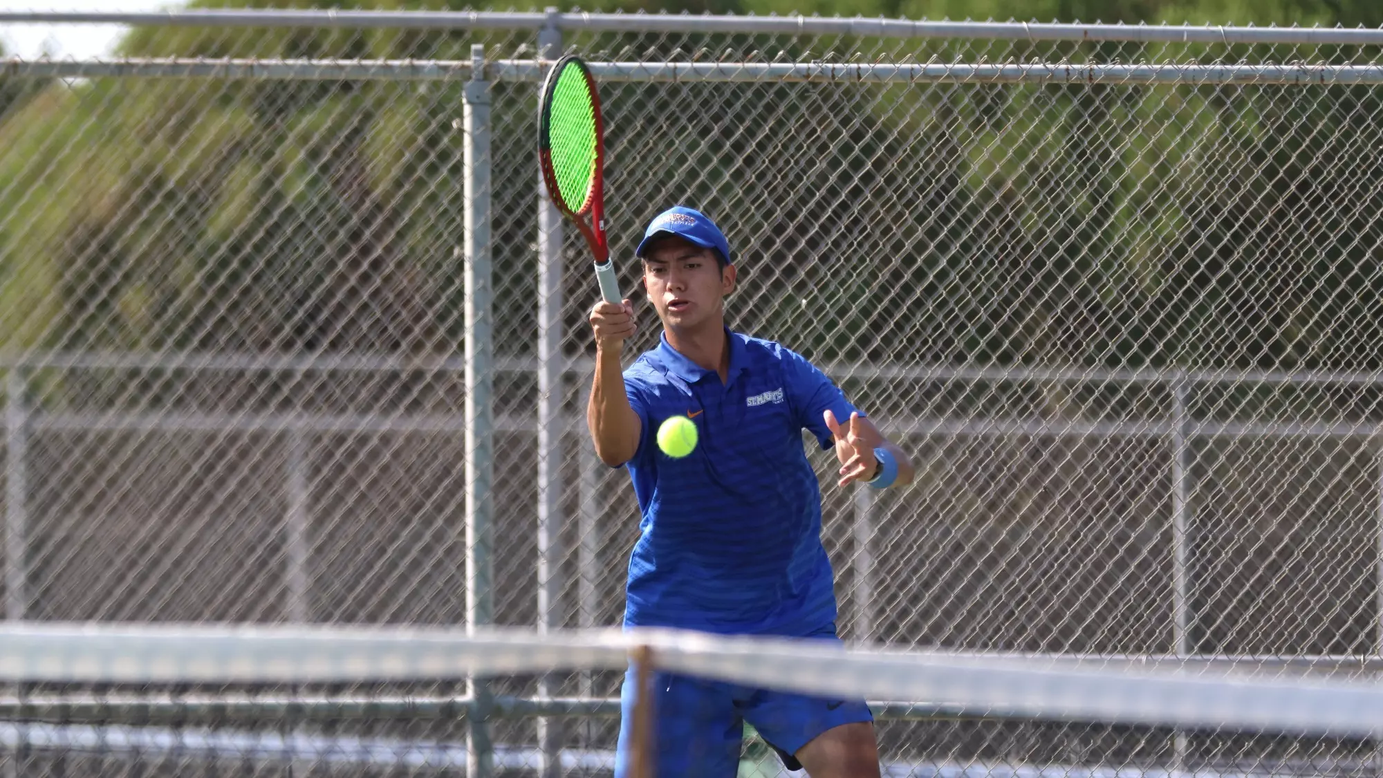 Diego Alvarez hits a forehand at the ITA South Central Regional