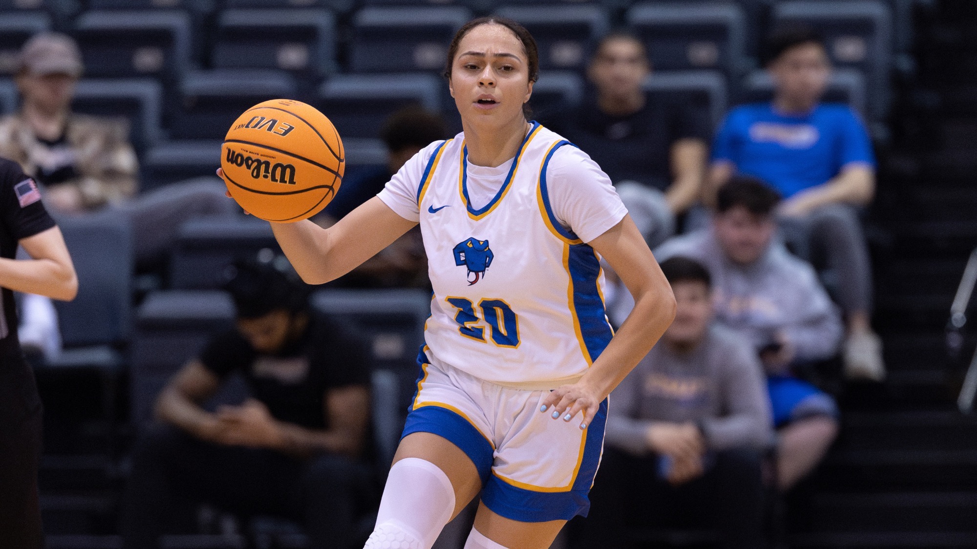 Quezia Bertoni dribbles down the court.