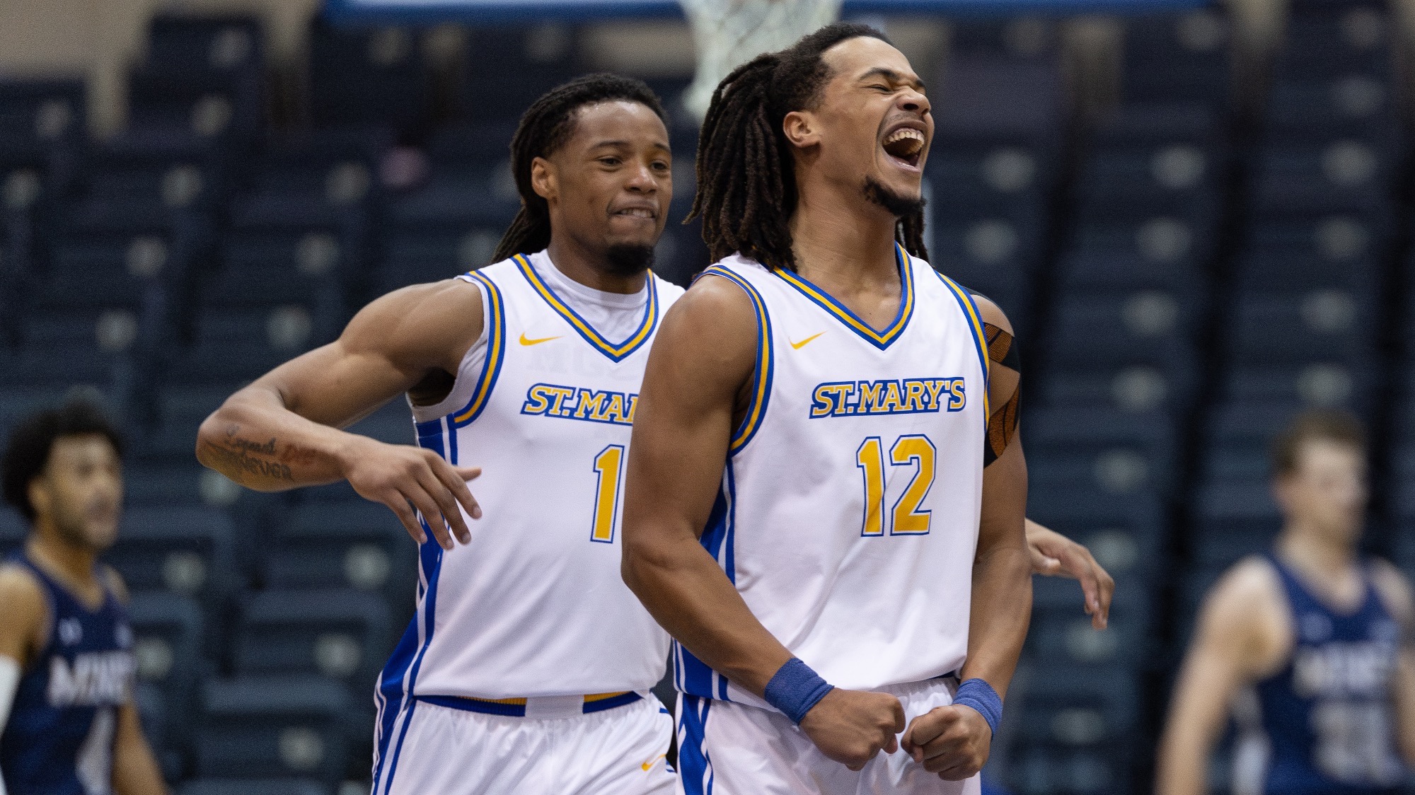 JJ Walton walks up behind Justin Britt to help him celebrate.