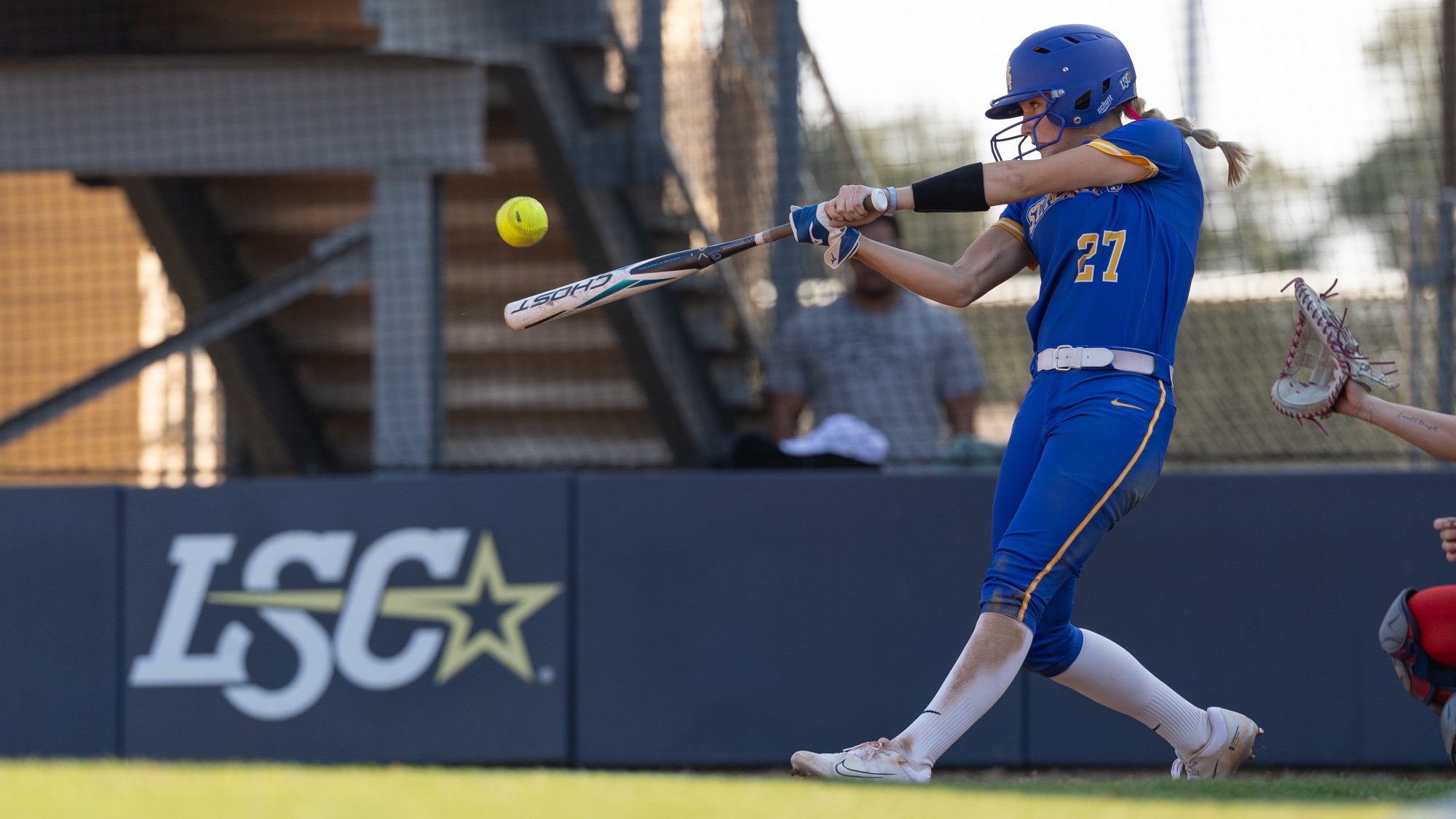 Reagan Tennill swings at a pitch for a hit against MSU Denver.