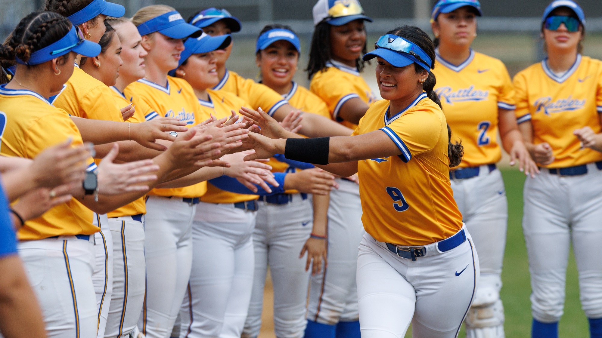 Gabriela Banda goes around the circle to give high fives as she is introduced in the starting lineup.