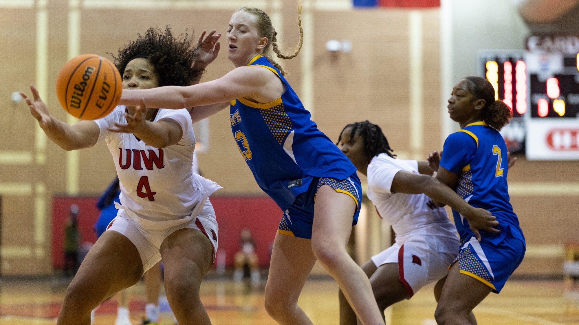 Raynne Malik pushes away a pass attempt by UIW.