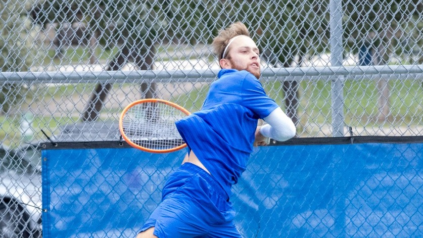Florian Smalto hits a one-handed forehand.