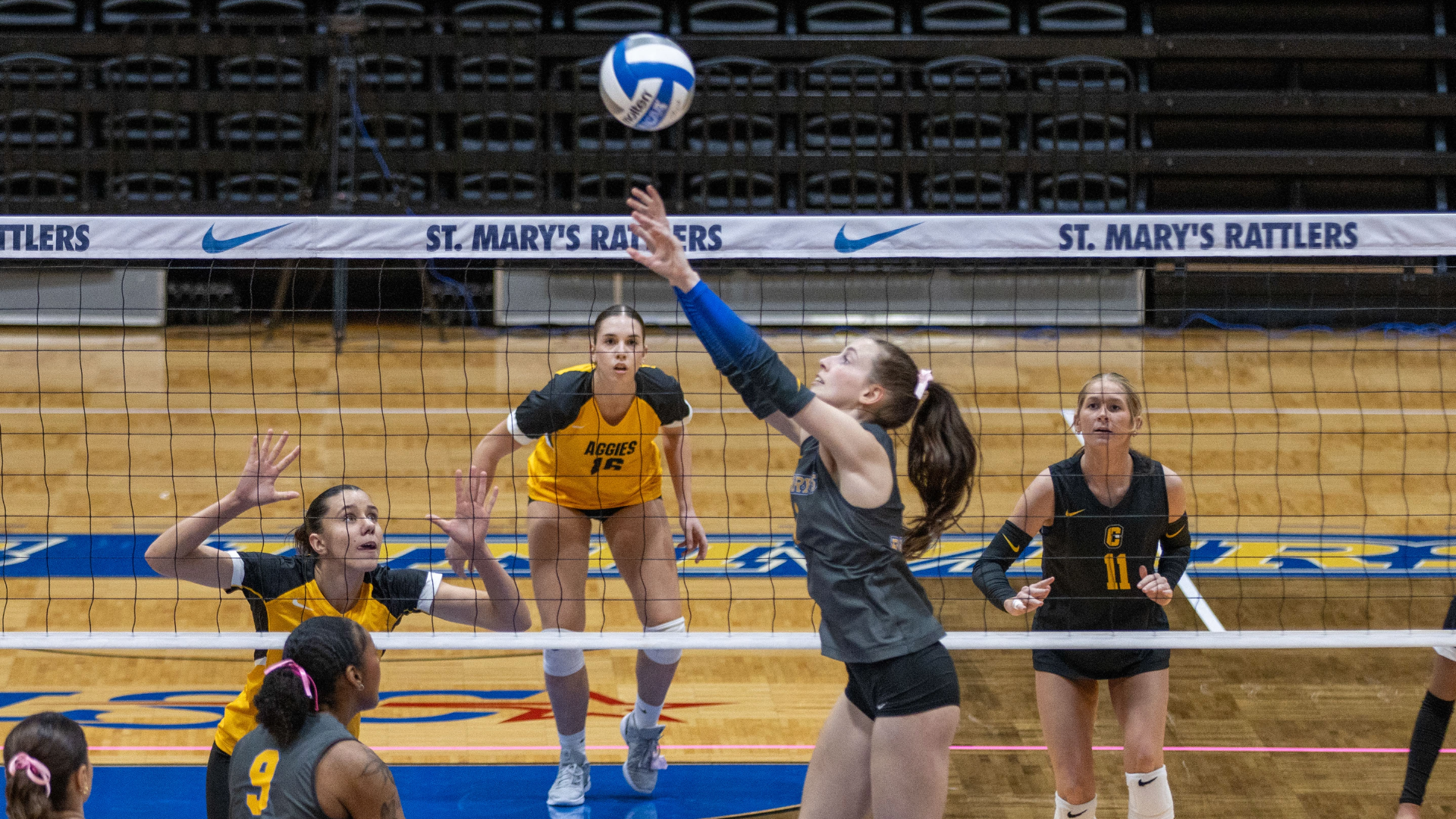 Haleigh Wilk sets the ball to the left side against Cameron.