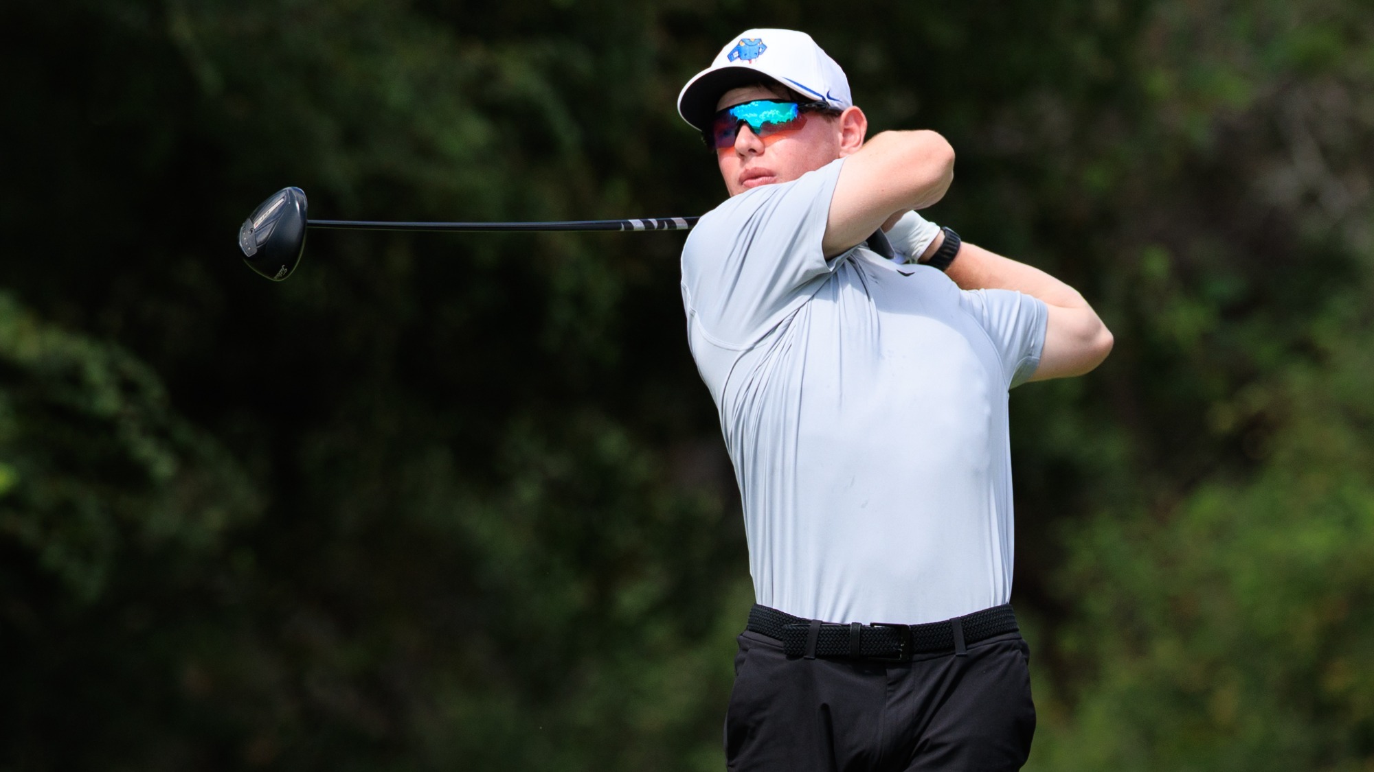 Daniel Levy finishes his follow through after teeing off.