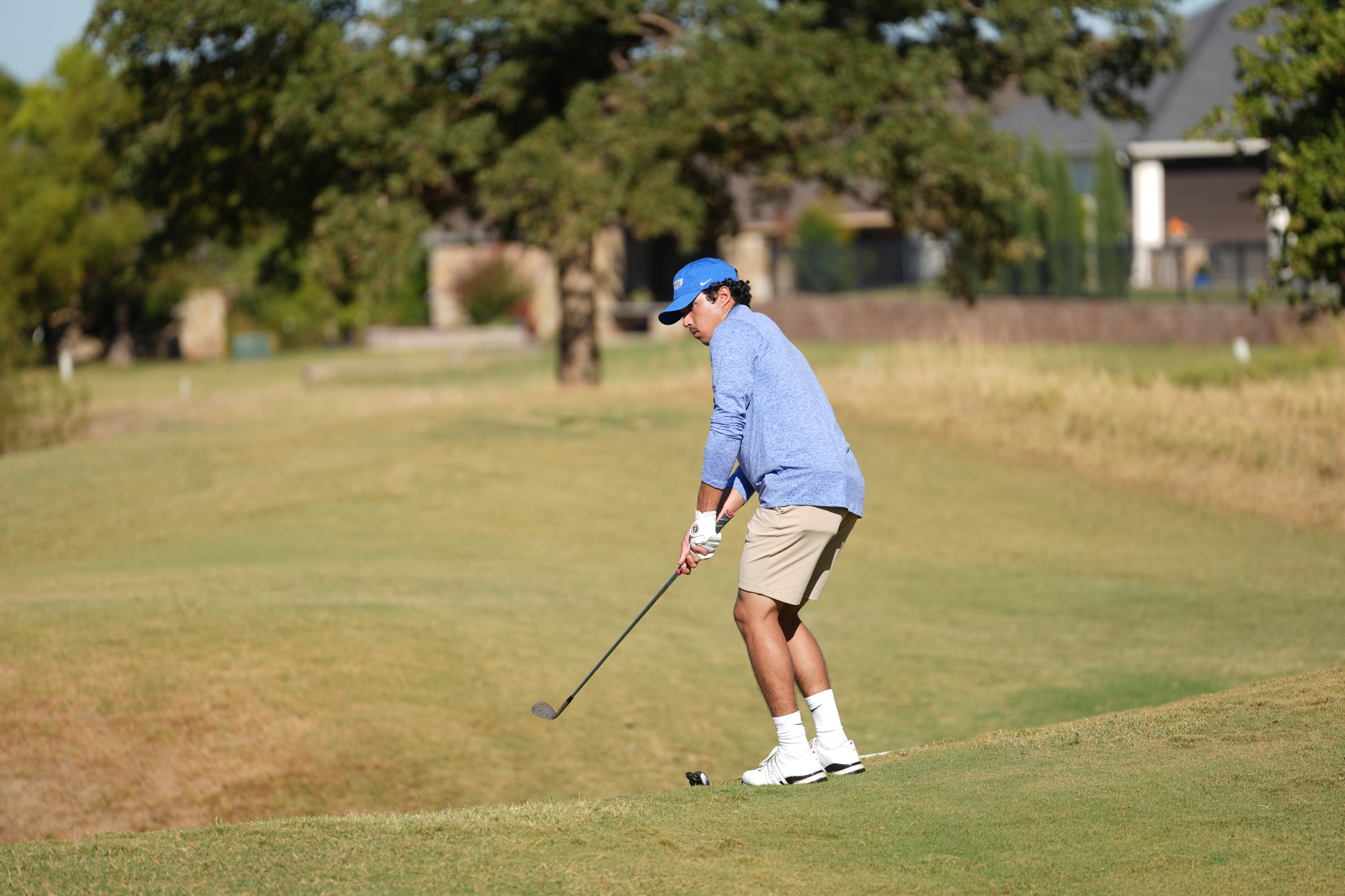 Fabrizio De Abreu takes a shot from the fairway.