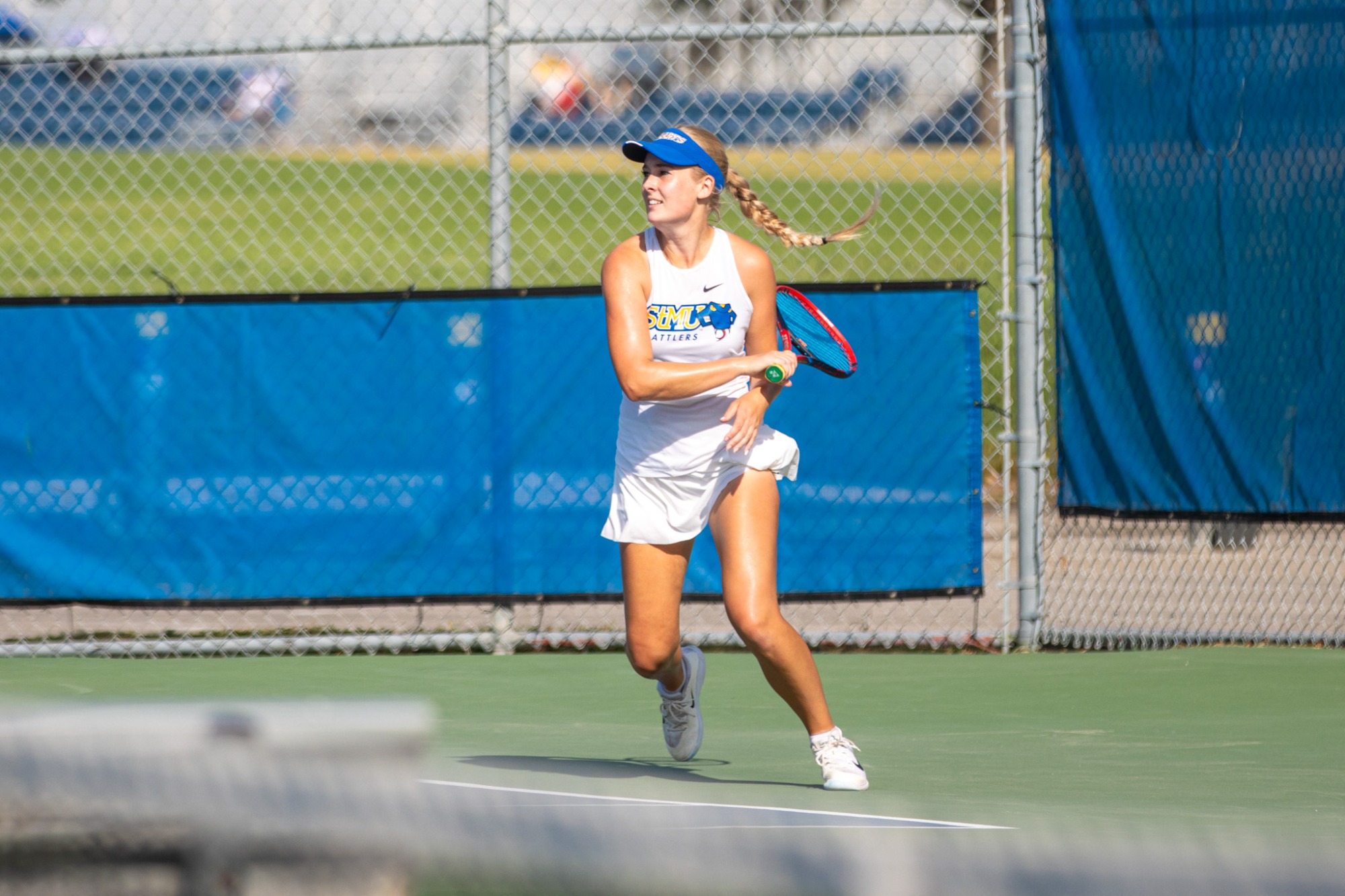 Isabella Olsson returns a forehand from the baseline.