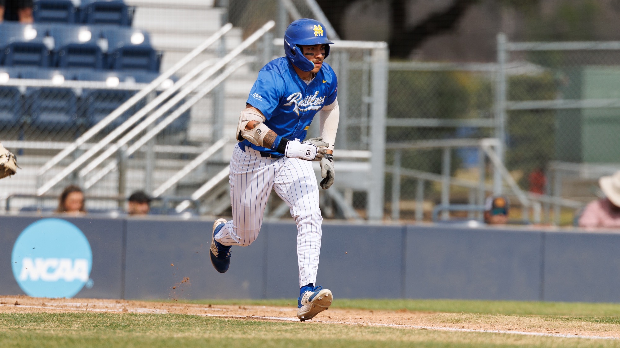 Ryan Alaniz runs down the first base line after getting a hit against Oklahoma Christian.