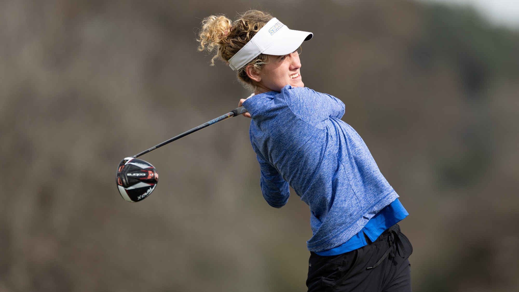 Brielle Burns watches the flight of her ball after teeing off.