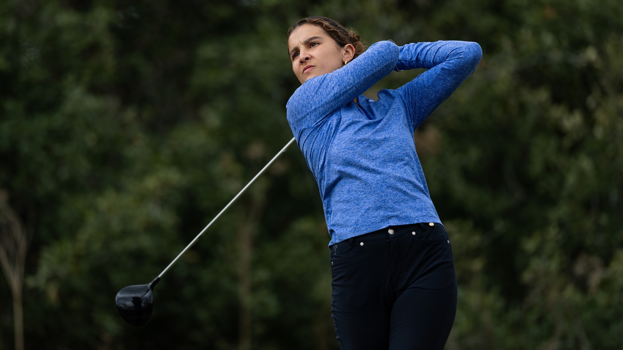 Manon Verret concludes her follow through after teeing off at the Texas State Invitational.