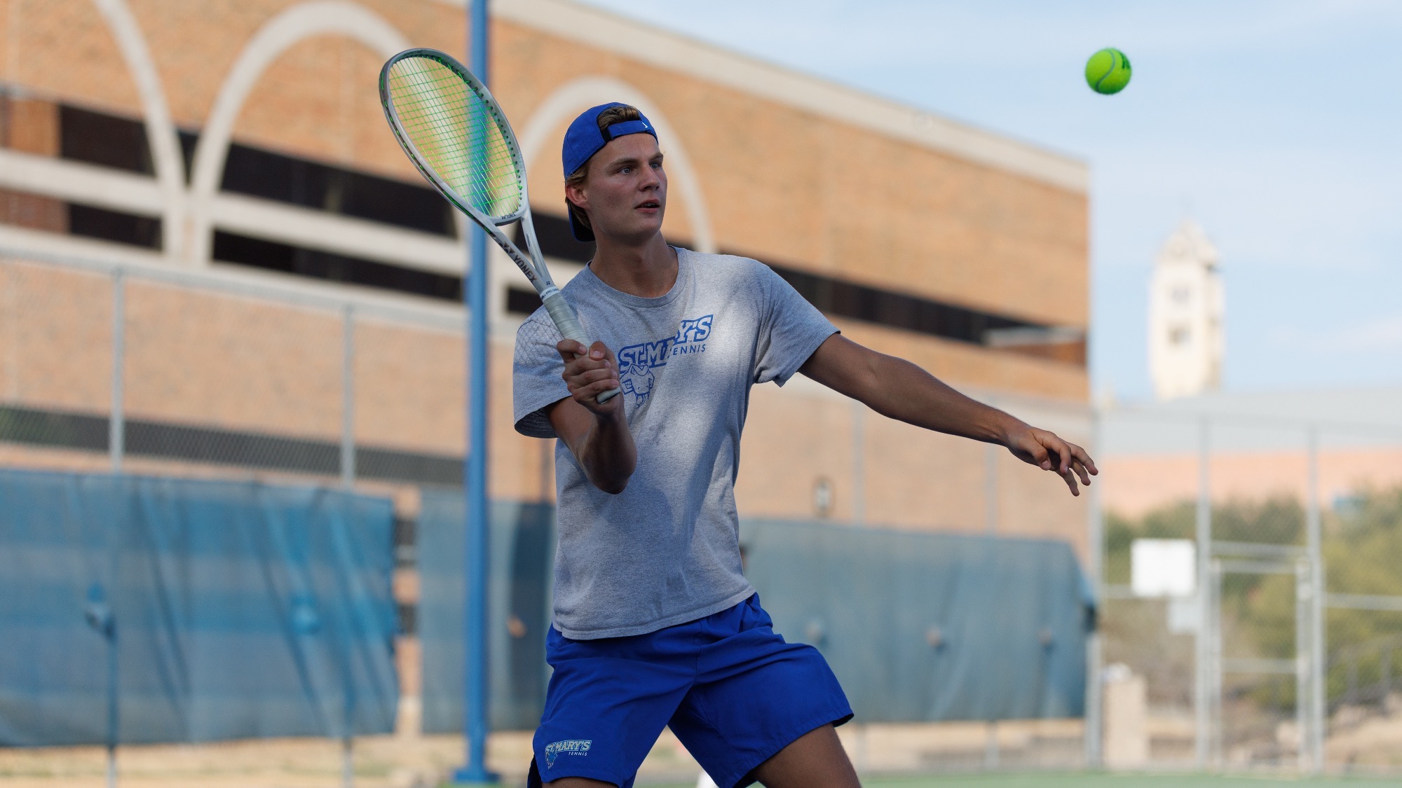 Louis Hein hits a one-handed lob shot at the Brother Al Invitational.