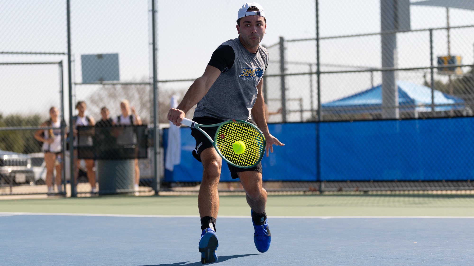 Aaron Ben Anton hits a slice backhand.