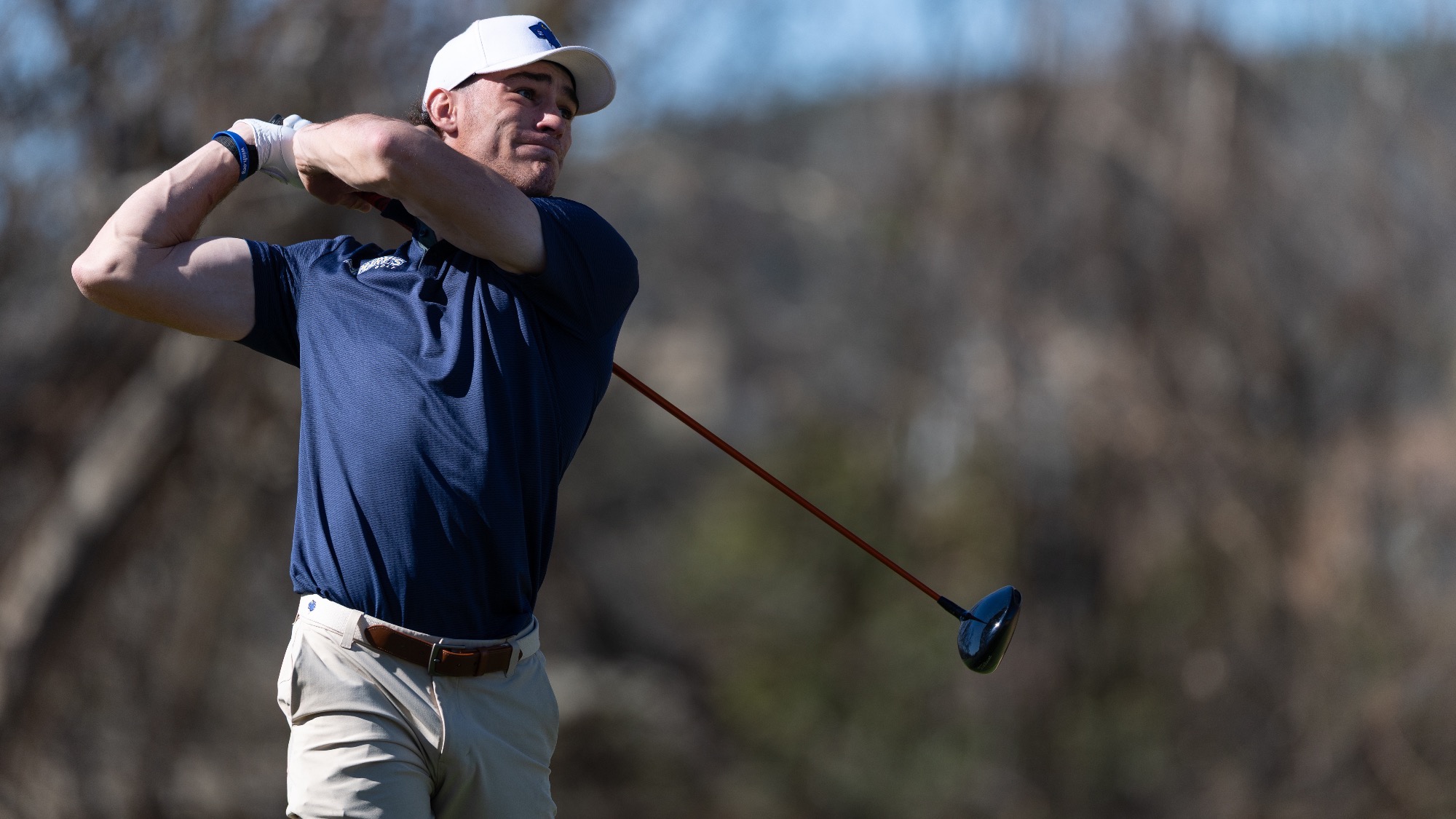 Baptiste Touchard exhales after teeing off at the Dominion Country Club.