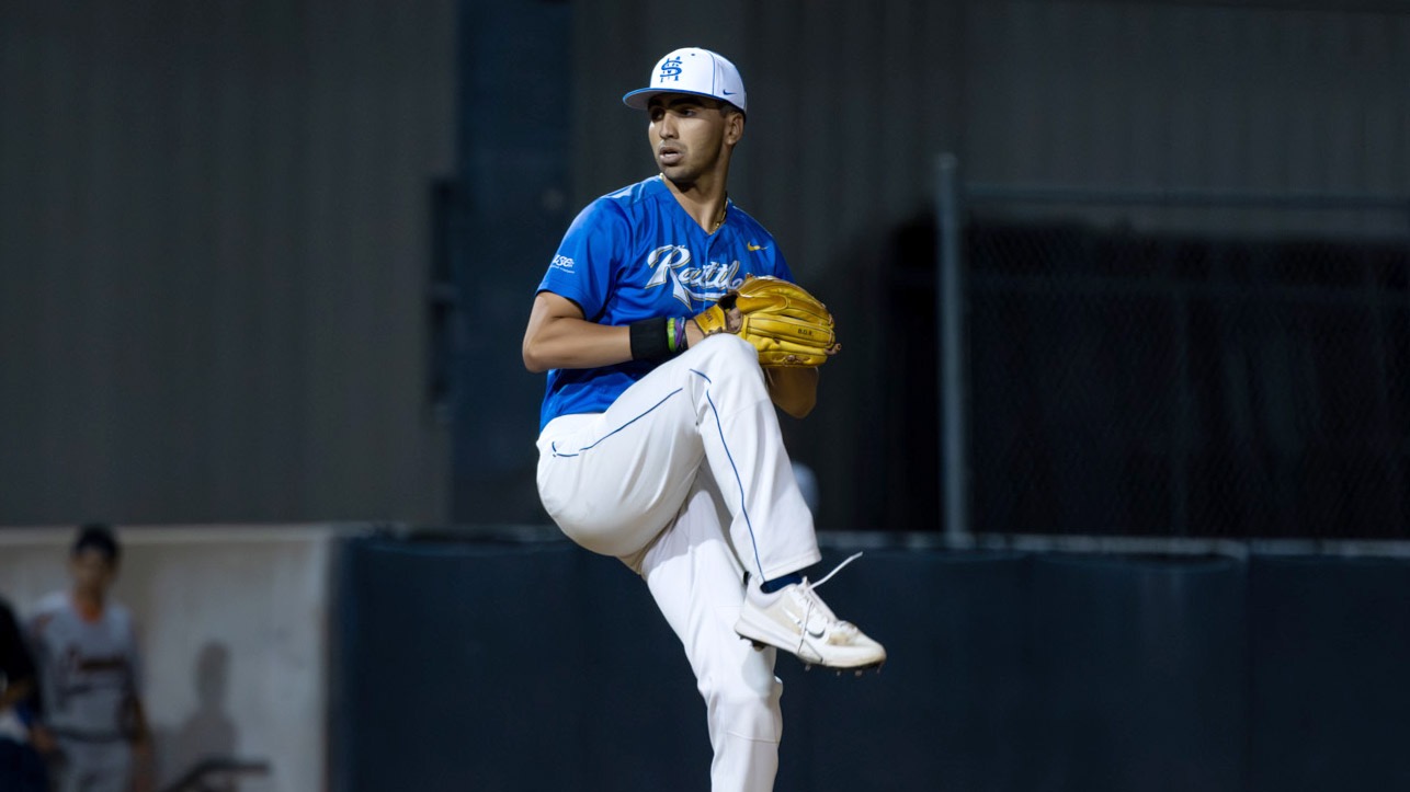 Joel Burgess begins his delivery to home plate.