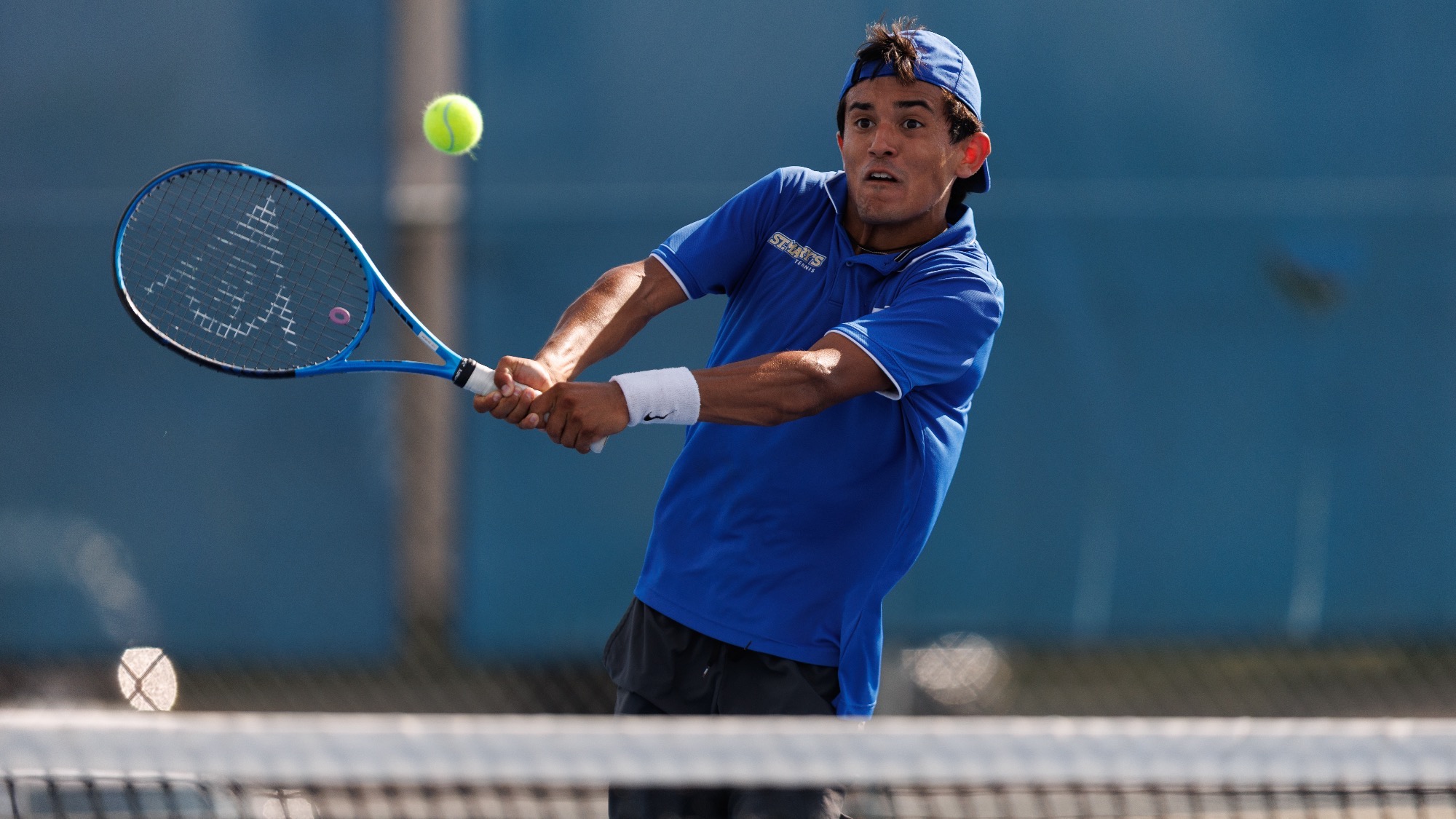 Lucas Castillo Sanchez hits a two-handed backhand at the Brother Al Invitational