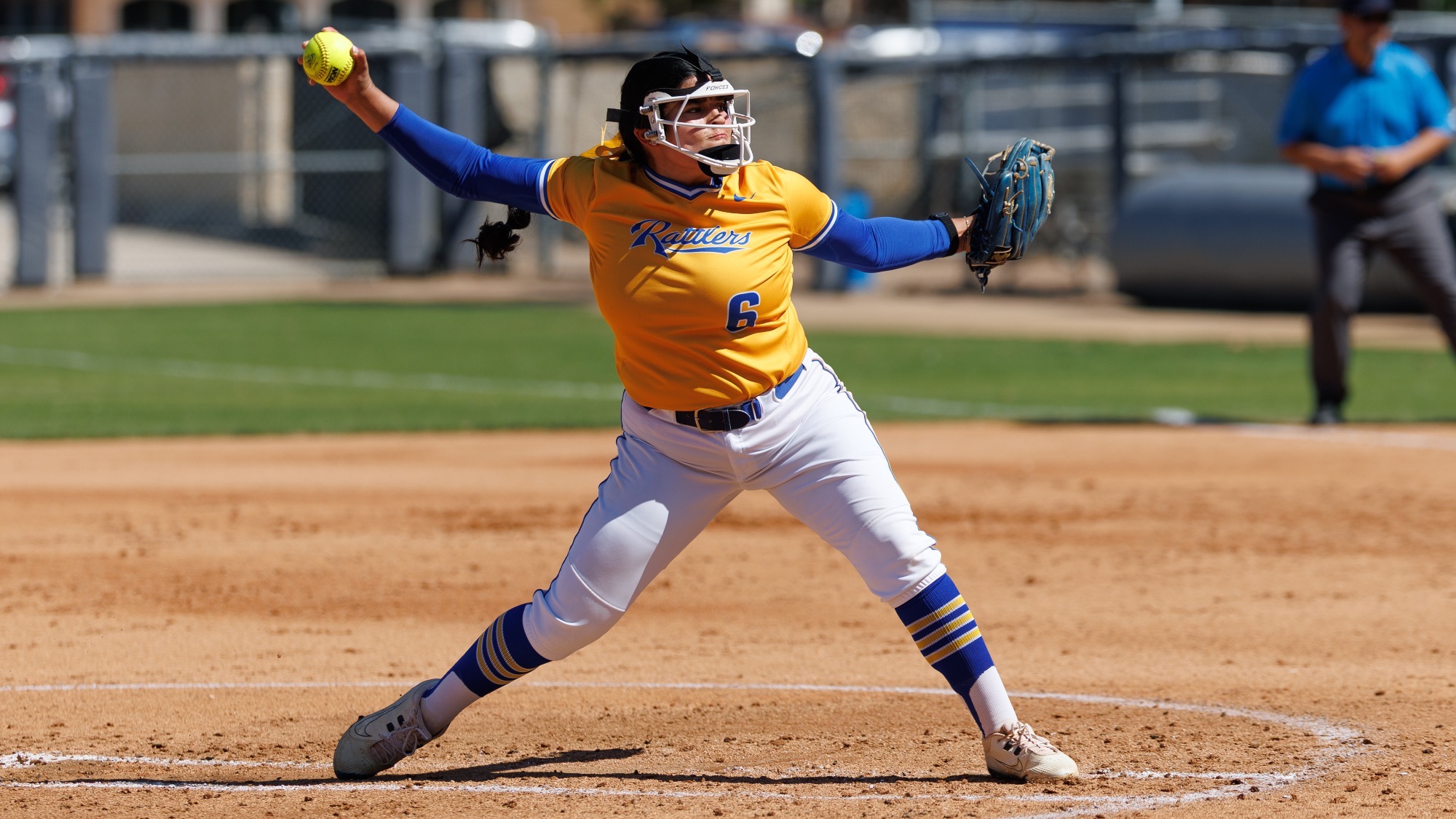 Ariella Saenz is 3/4 of the way through her windmill pitch.
