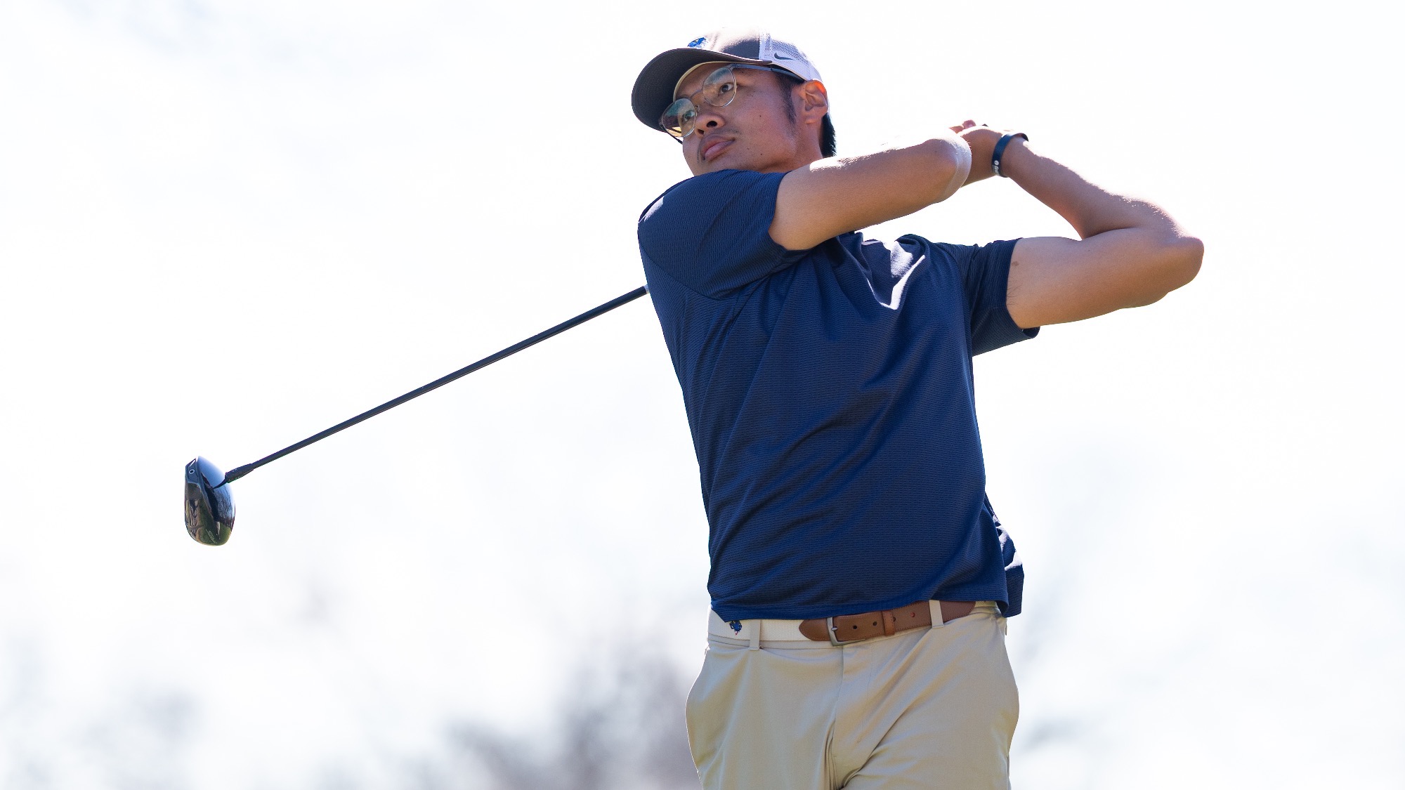 Kongpop Kaikaew looks into the distance after teeing off at the Rattler Invitational