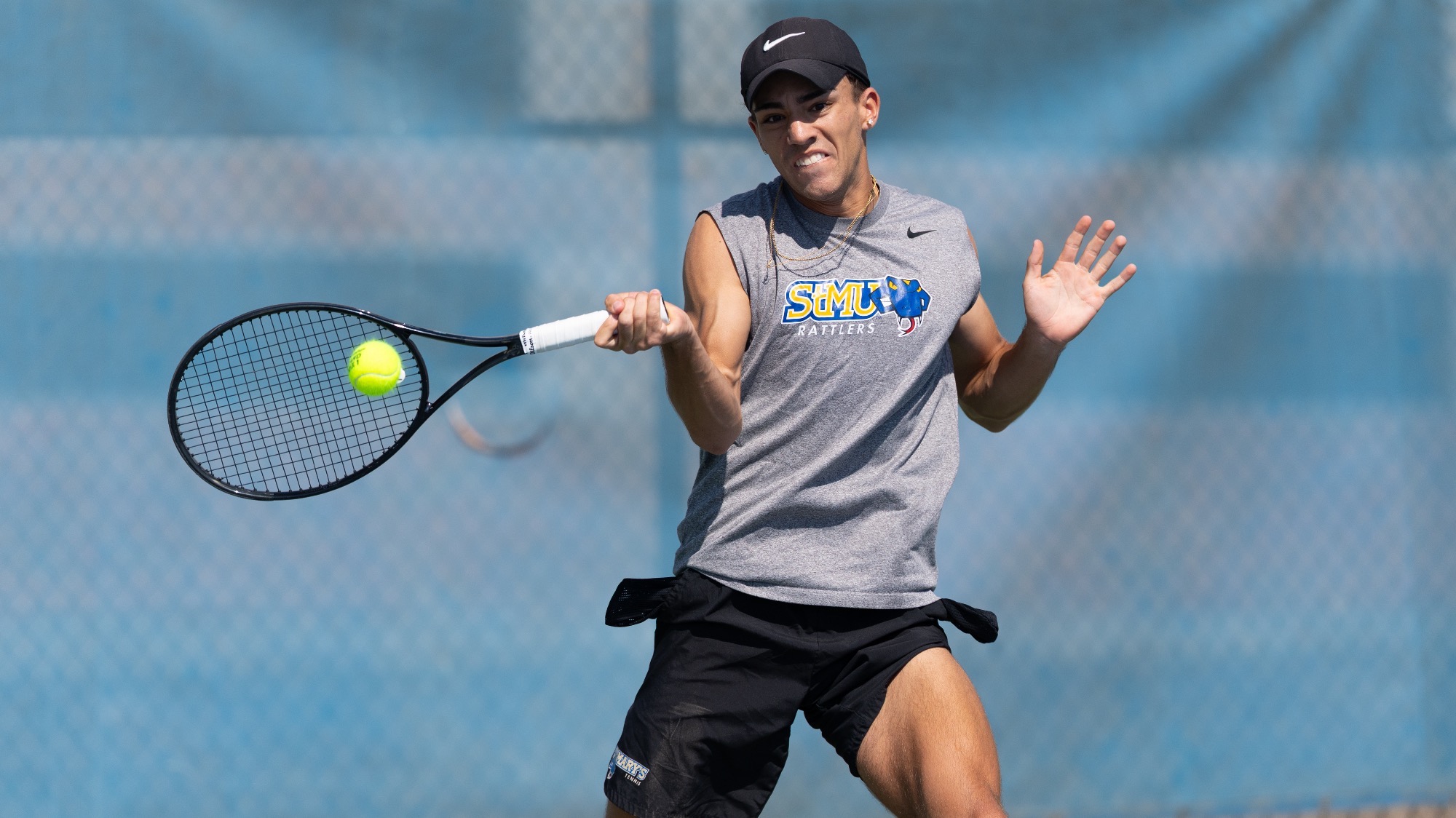 Lincoln Baldonado hits a one-handed forehand.