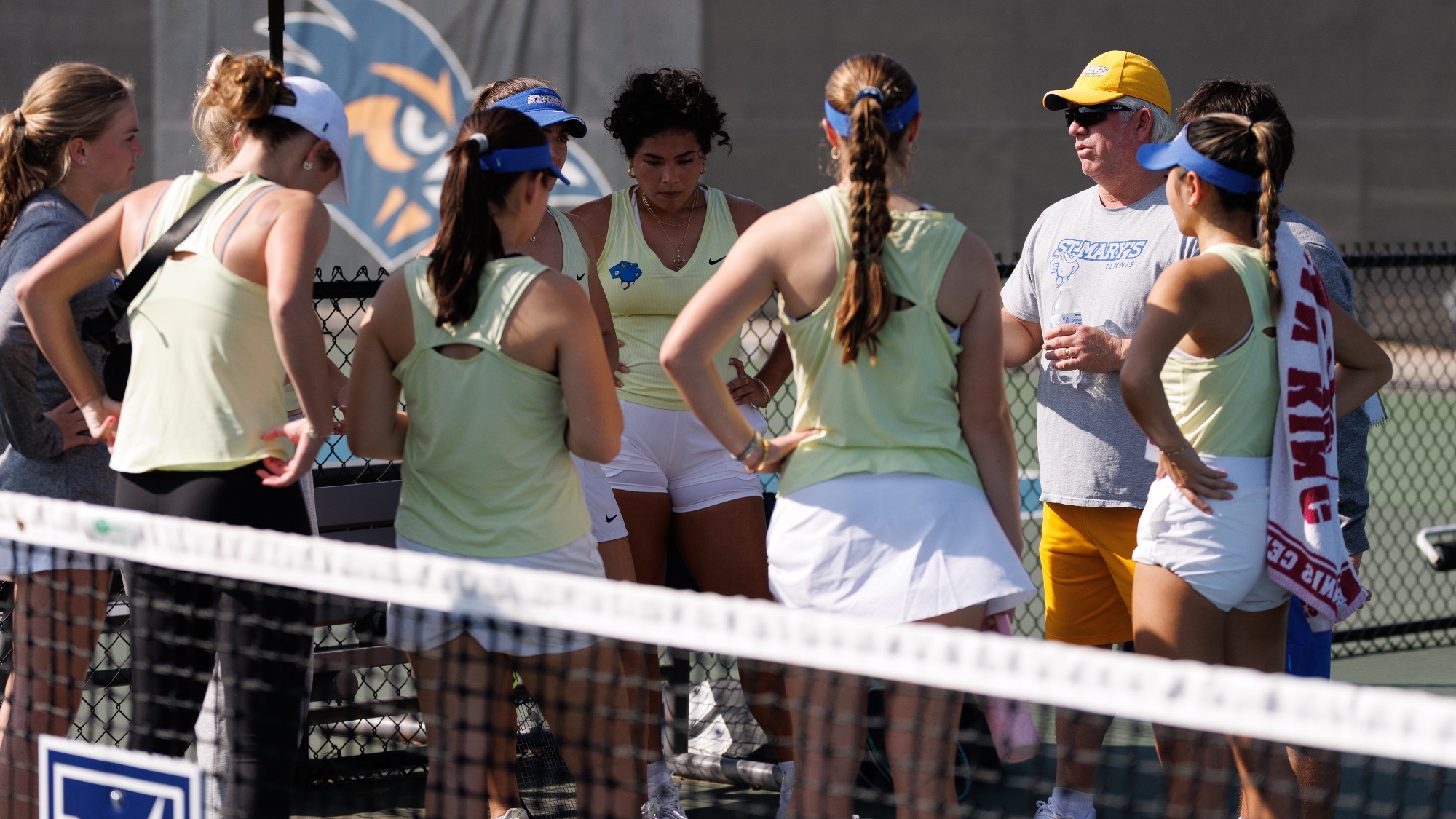 Coach Bill Macom talks with his team before the singles matches at UTSA