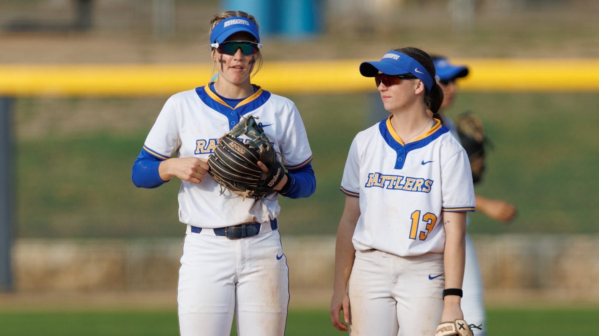 Raegan Tennill and Bryley Westfahl discuss a plan of attack for defense up the middle.