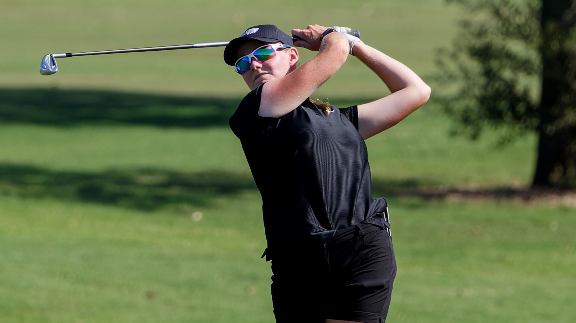 Taylor Wilczek finishes her shot from the fairway at DBU Classic