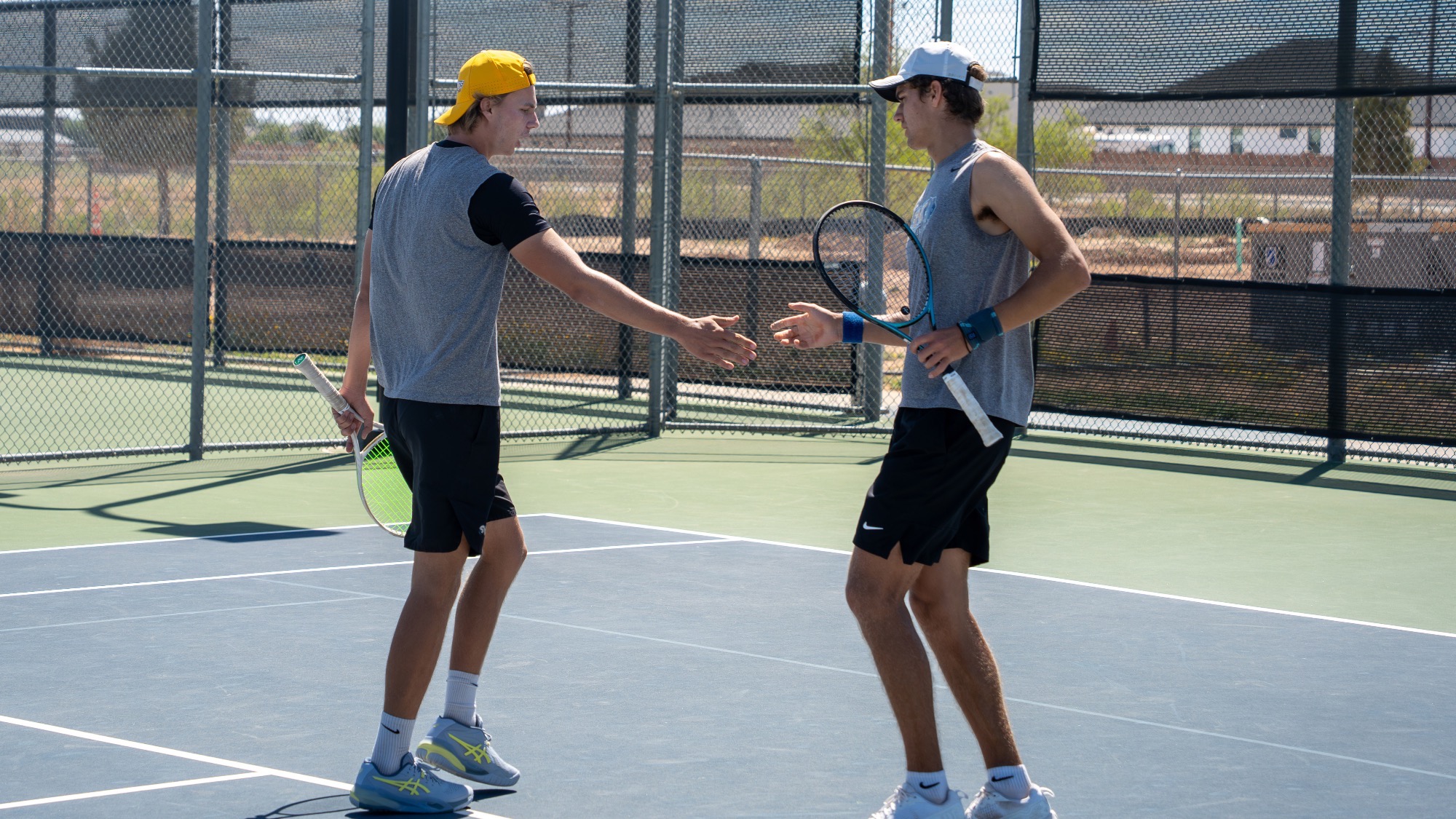 Louis Hein and Nikita Gavrilonoks give each other a 