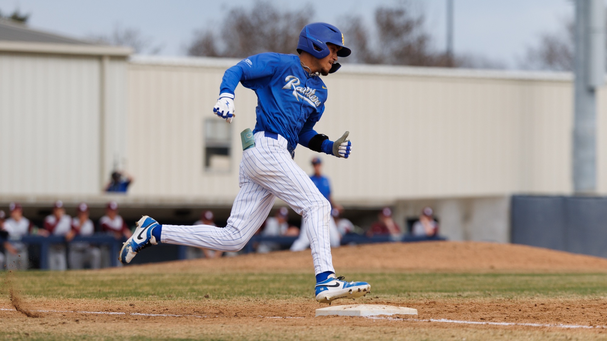 Jacob Tanguma rounds first base.