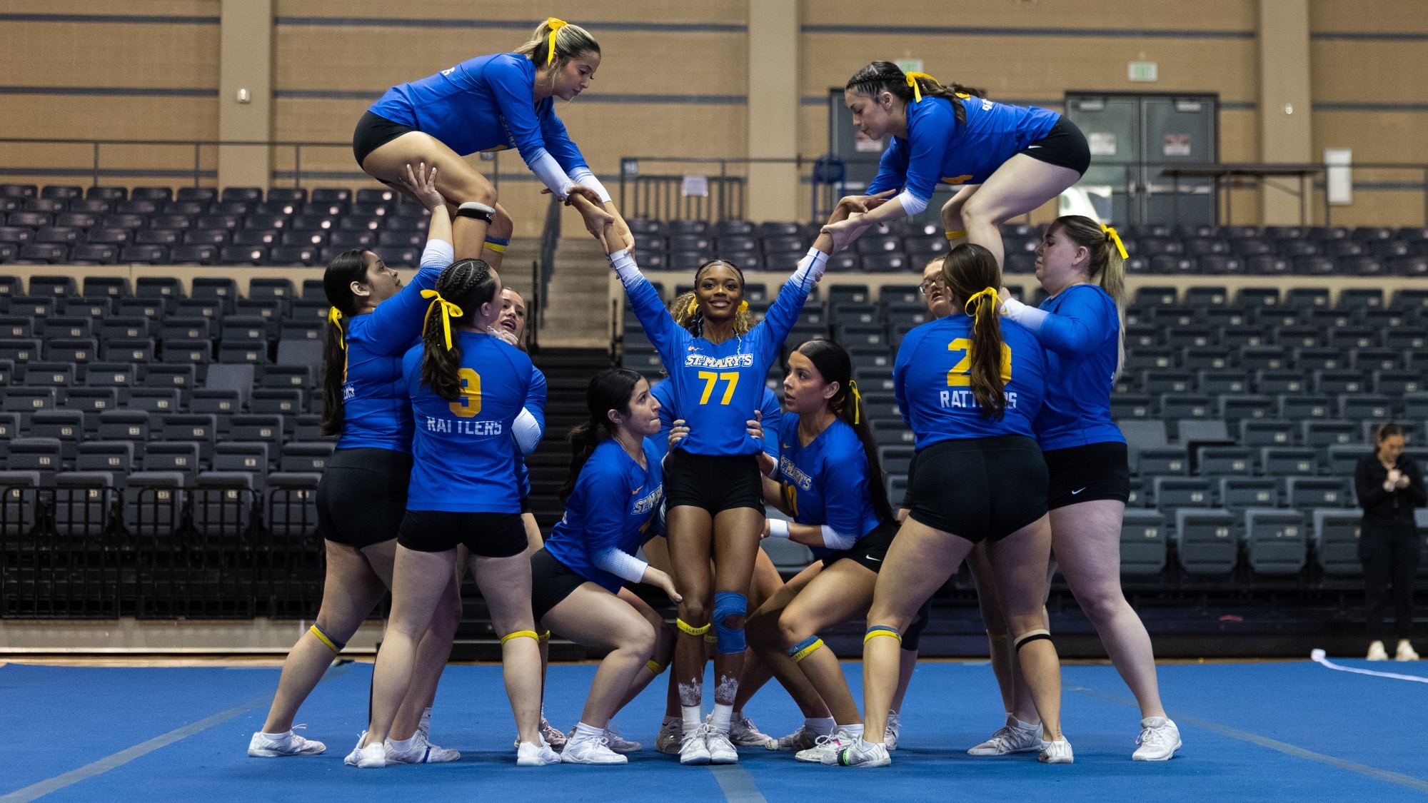 The STUNT team readies to lift freshman Taliiah Wilson, while Tiffany Gomez and Maddie Salinas are on the second level