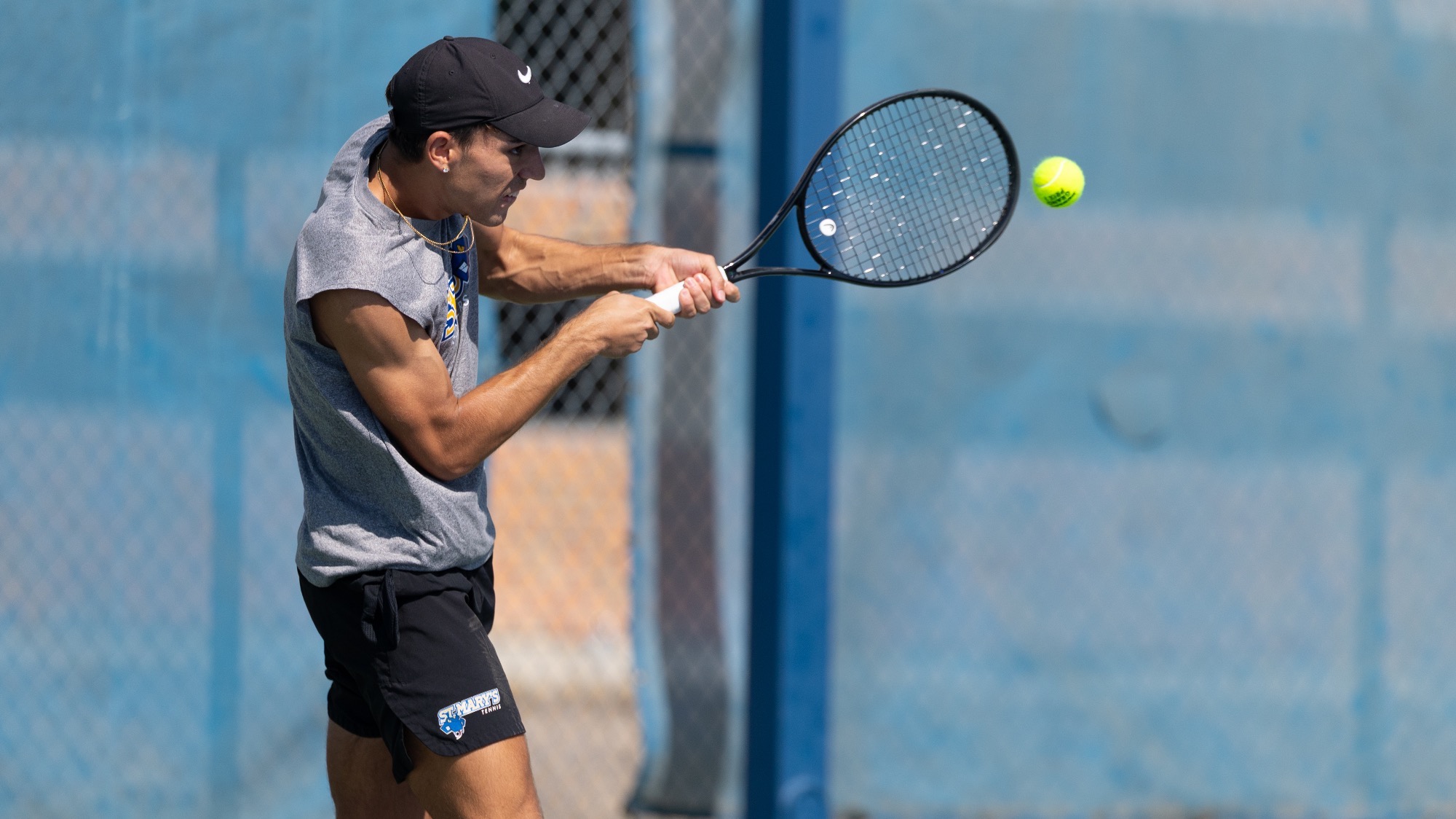 Lincoln Baldonado hits a two-handed backhand.