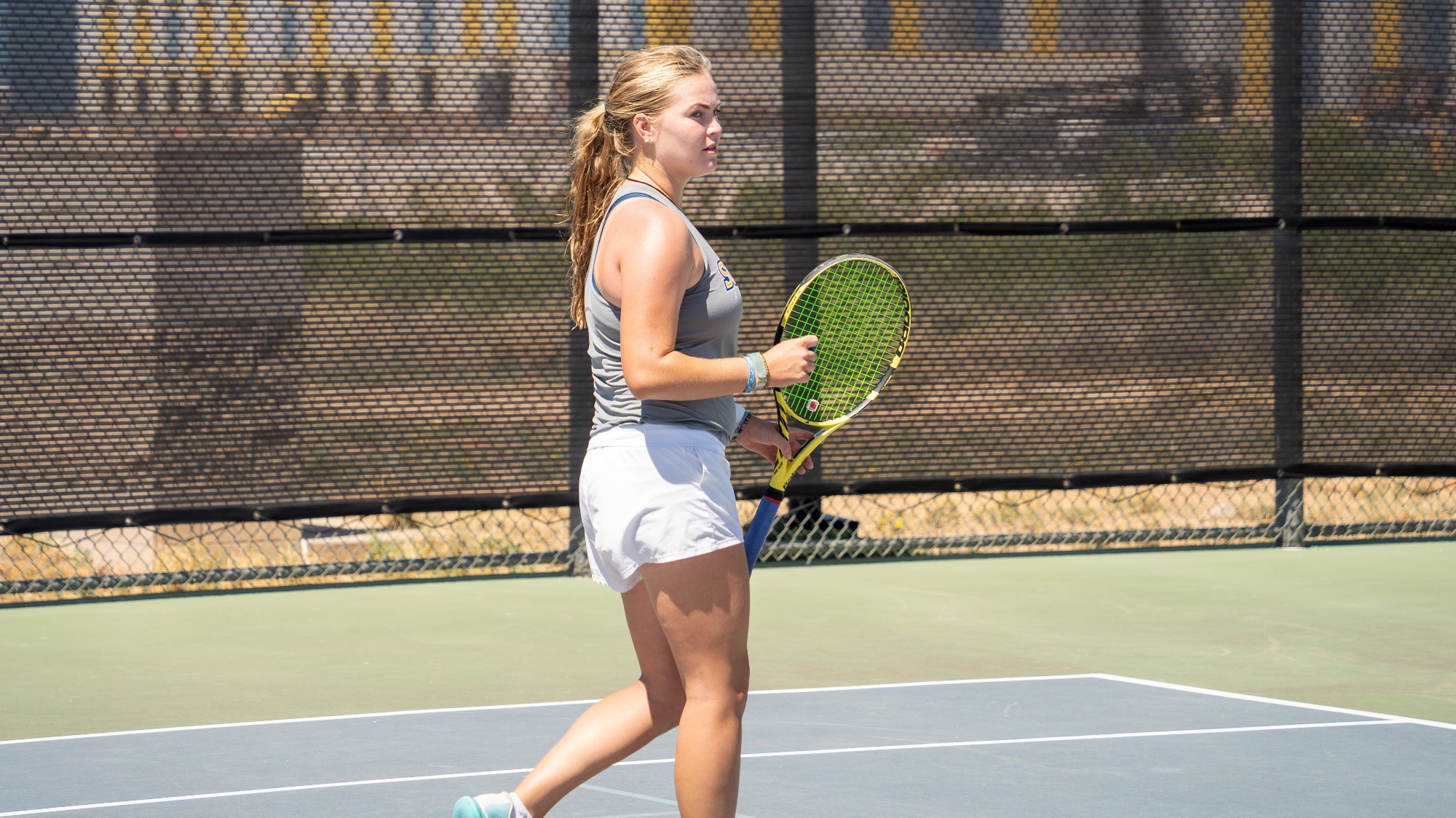 Breeze Simon clenches her right fist in celebration after winning a point.