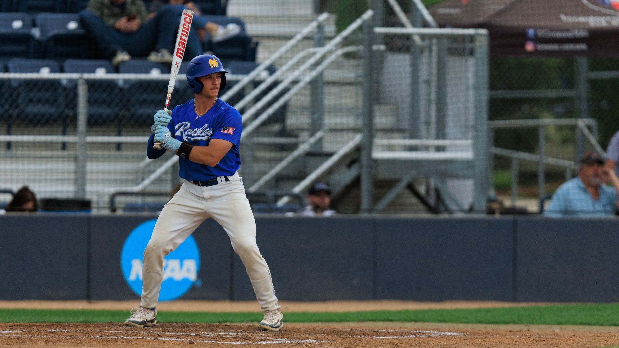 Ethan Hughes stands in the batters box, waiting on a pitch.