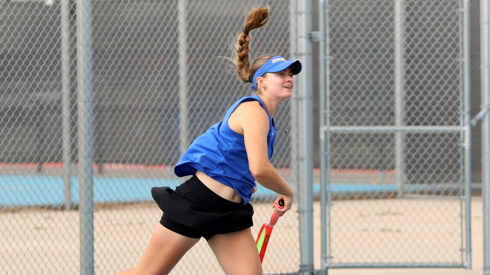Sarah Wooten lands after serving a ball at Lubbock Christian.