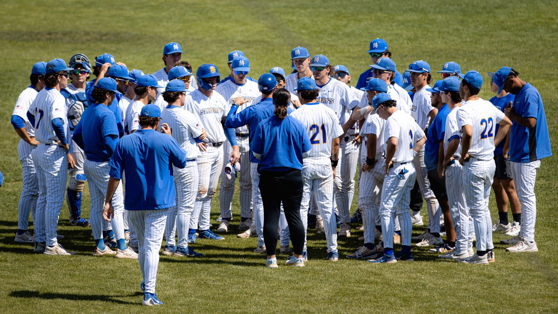 The Baseball team huddles in the outfield around Head Coach Kellner after dropping a 5-3 game to WT.