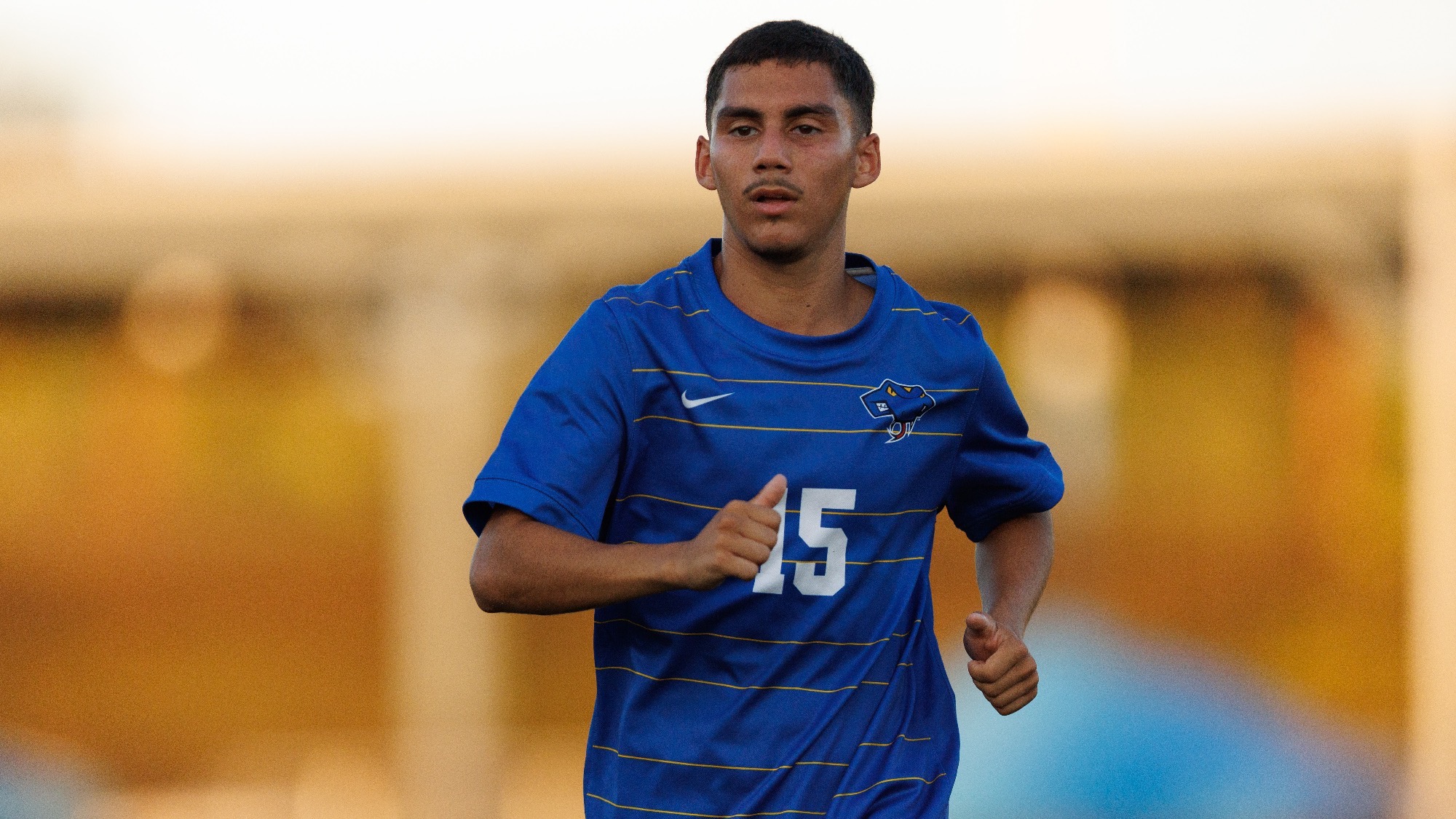 Dyllan Mendoza runs on the pitch.