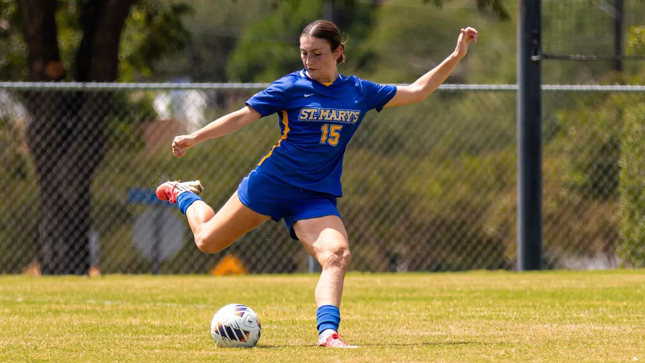 Anabelle Rodriguez kicks the ball against Lynn.