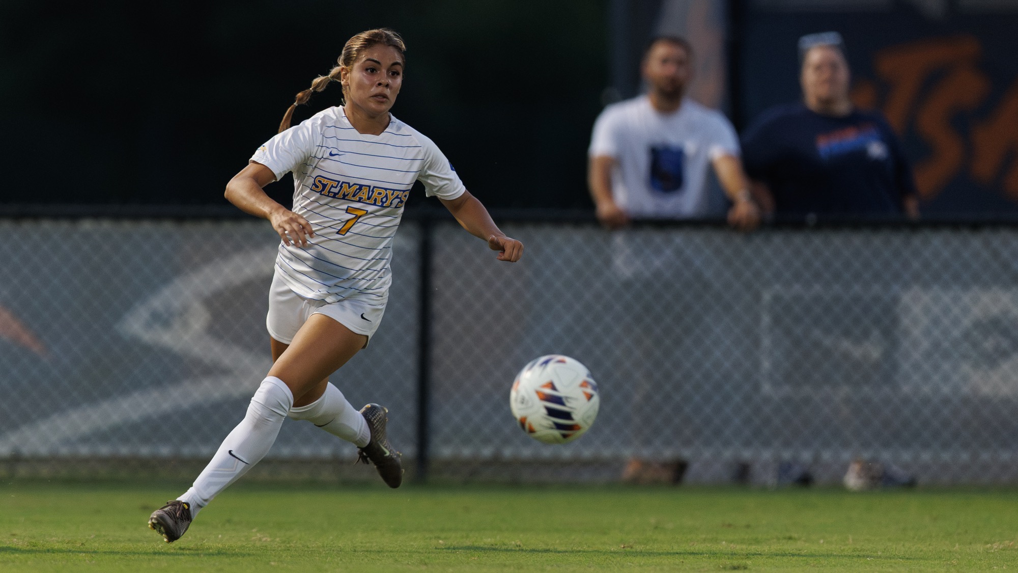 Helen Lazaro looks upfield as she runs toward the ball.