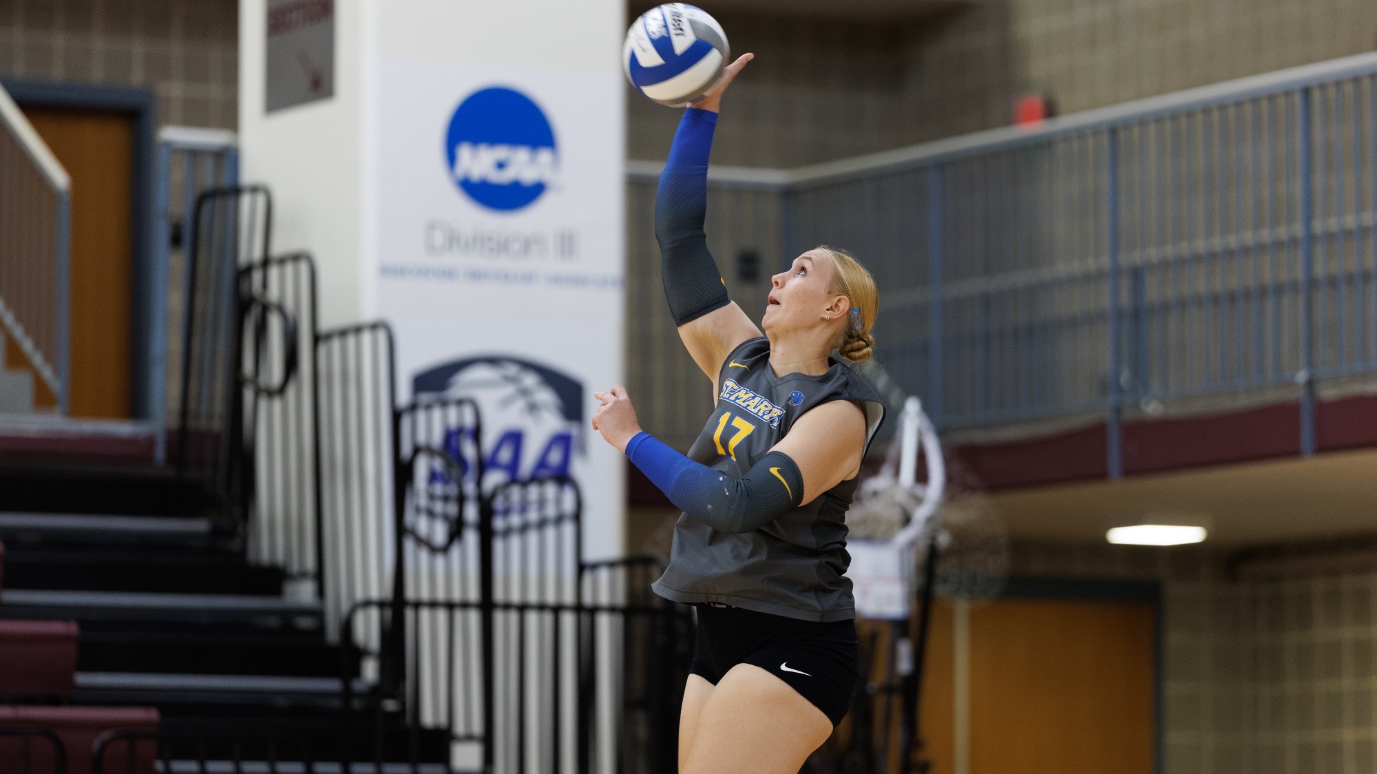 Tara Creekmore serves the ball at Trinity.