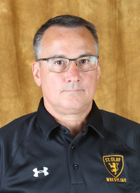 A headshot of St. Olaf assistant wrestling coach Tom Evan.